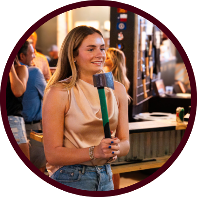 Learn to throw axes and knives in College Station, TX from pro throwing coaches at The Cut Axe Throwing.