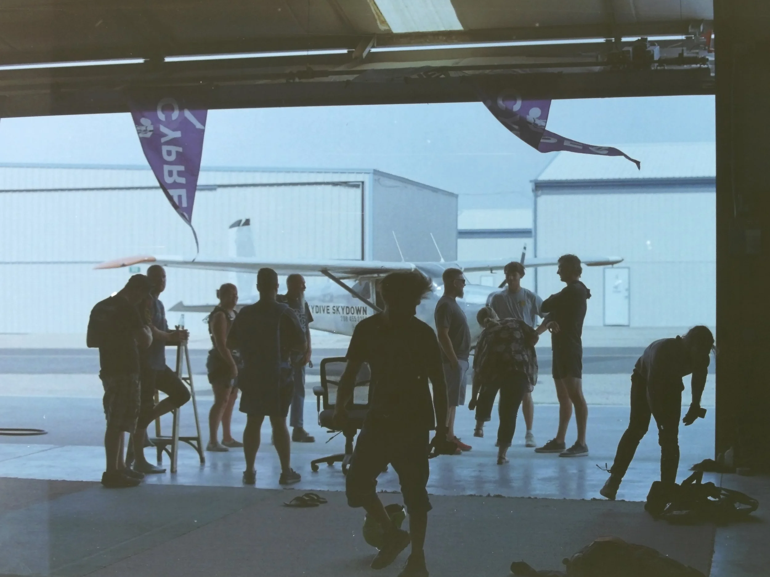 Skydivers gearing up and preparing for their jump in front of the Skydive Skydown aircraft during the 2024 season.