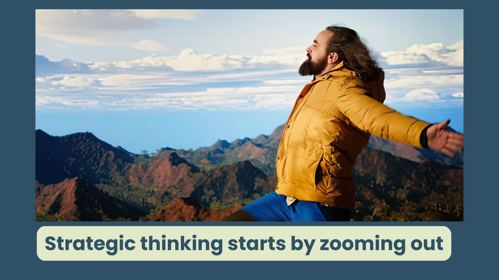 A man is standing on a mountain, his arms are outstretched and he takes in the wide view