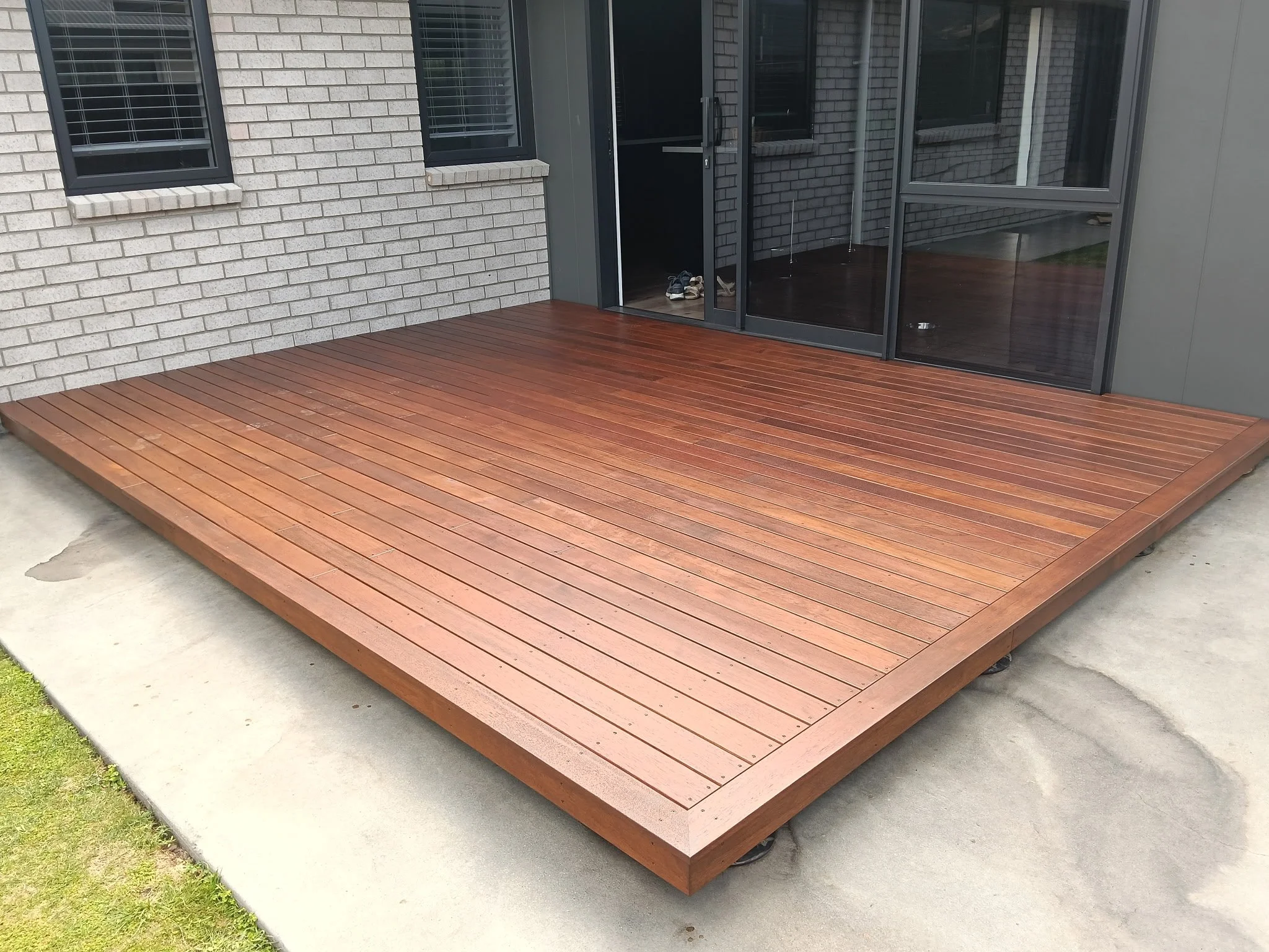 Kwila Deck built over concrete patio on Nurajacks. 