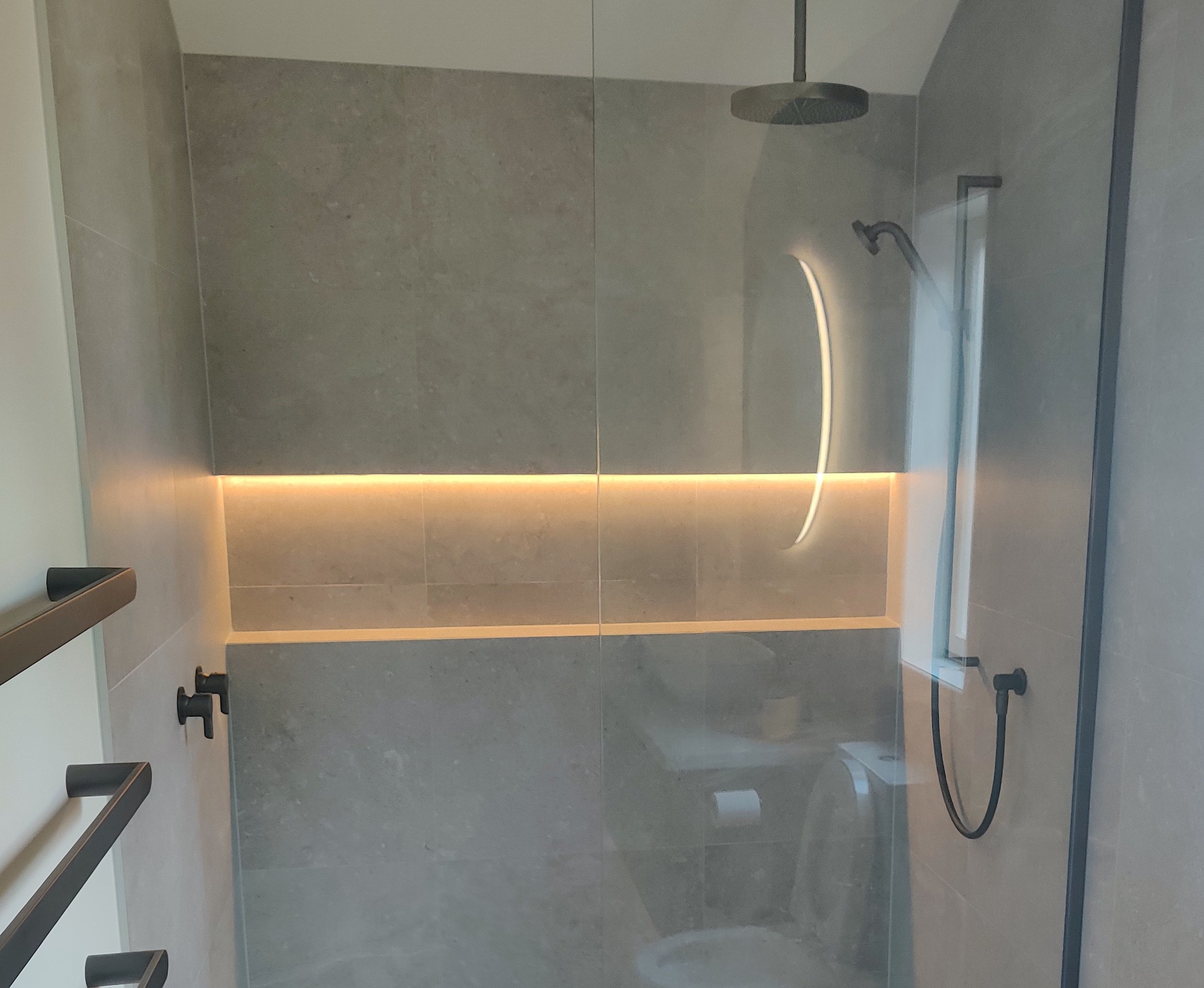 Built in shower shelf lighting, LED mirror & heated towel rail