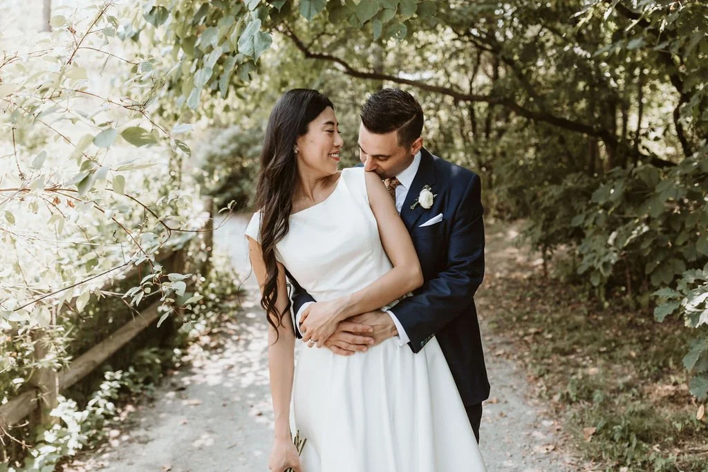 Micro wedding ceremony at Evergreen Brick Works garden pavilion in Toronto with greenery backdrop