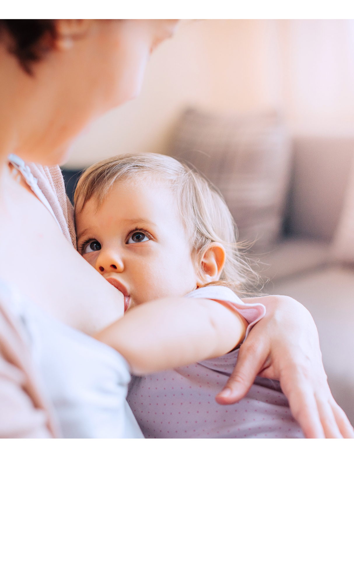 Mom breastfeeding older baby
