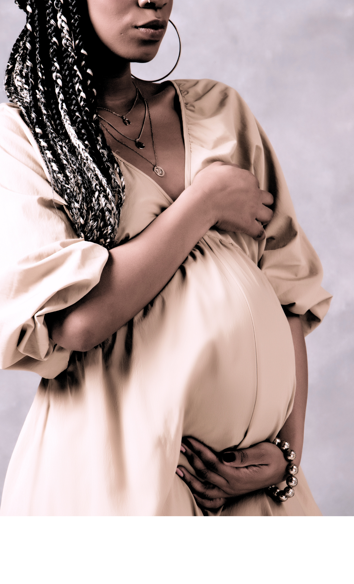 Pregnant mother cradling belly