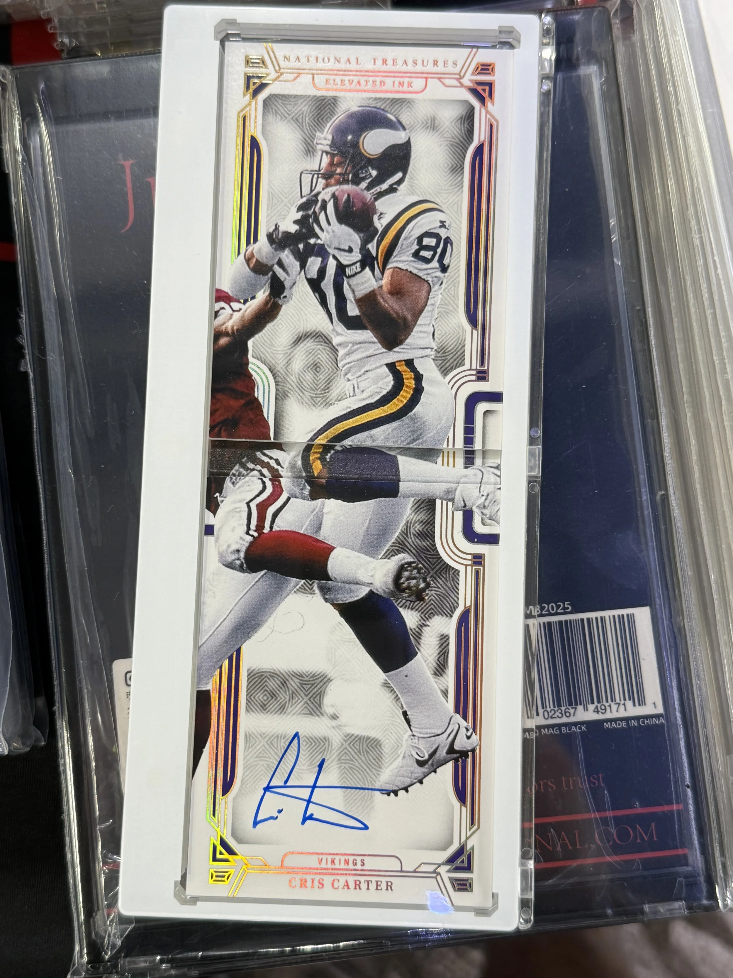 A football trading card featuring Cris Carter of the Minnesota Vikings catching a football, with an autograph signature at the bottom.