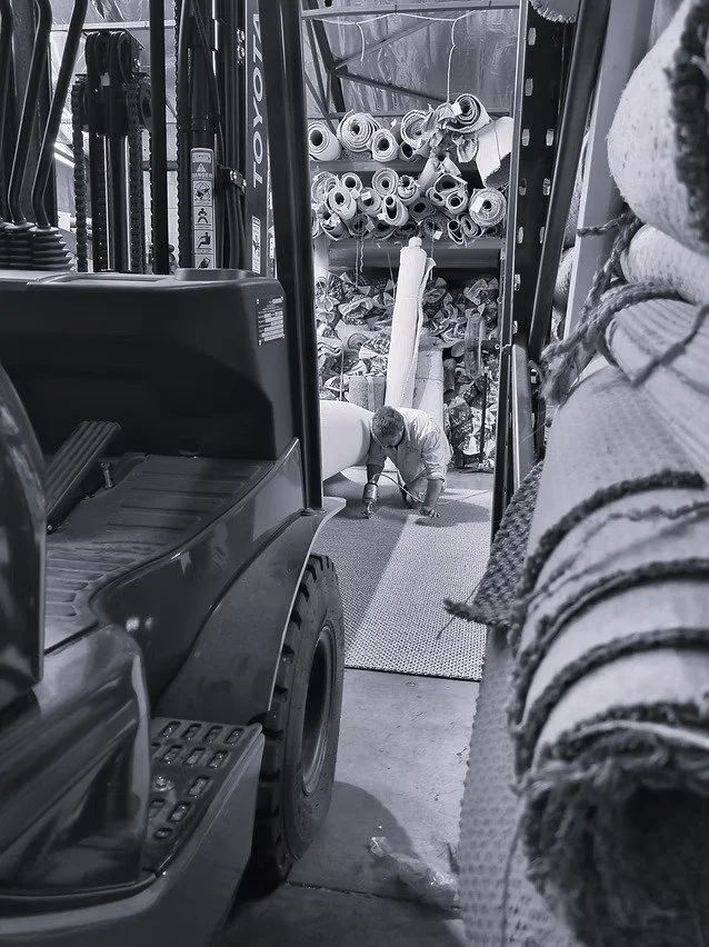 Skiled in house staff member working with Natural fibre flooring