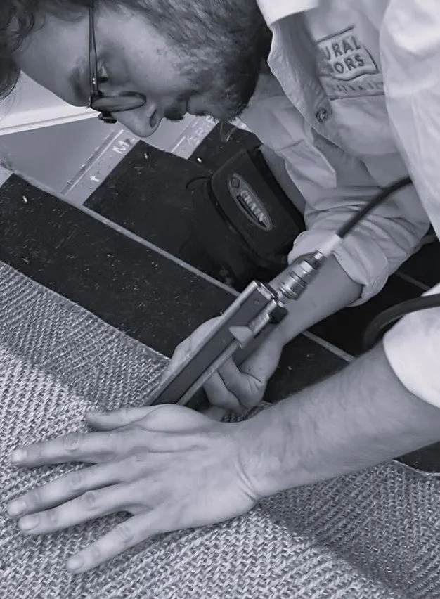 Highly skilled in house staff member installing natural fibre flooring sisal staircase
