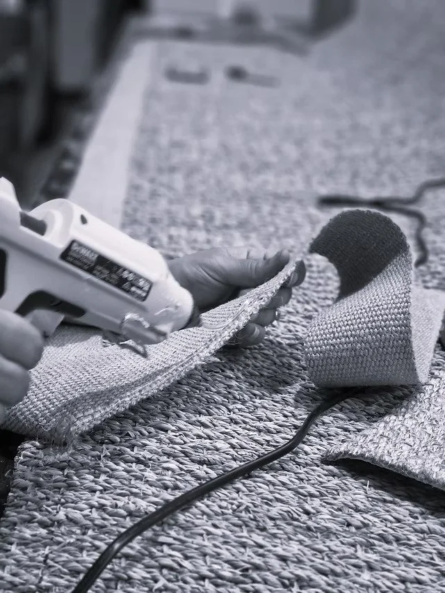 Highly skilled craftsperson making a custom natural fibre rug in Adelaide