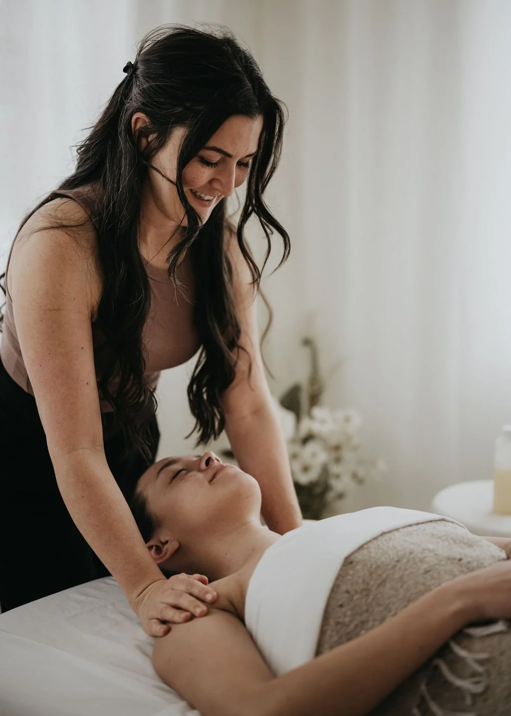 Maddie Lee supports a pregnant woman preparing for birth.