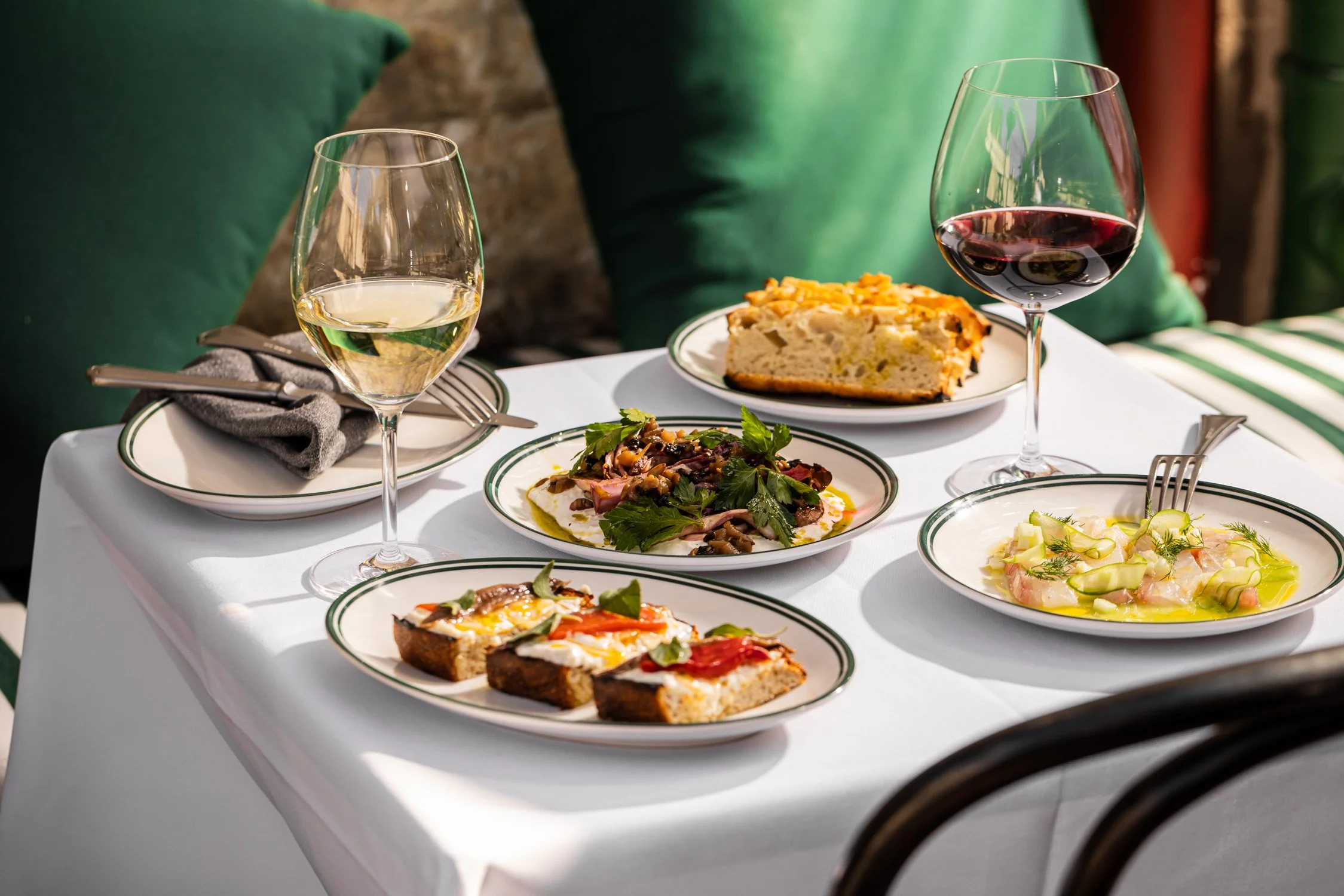 A table of Italian share plates and wine in our Italian style courtyard located in Surry Hills