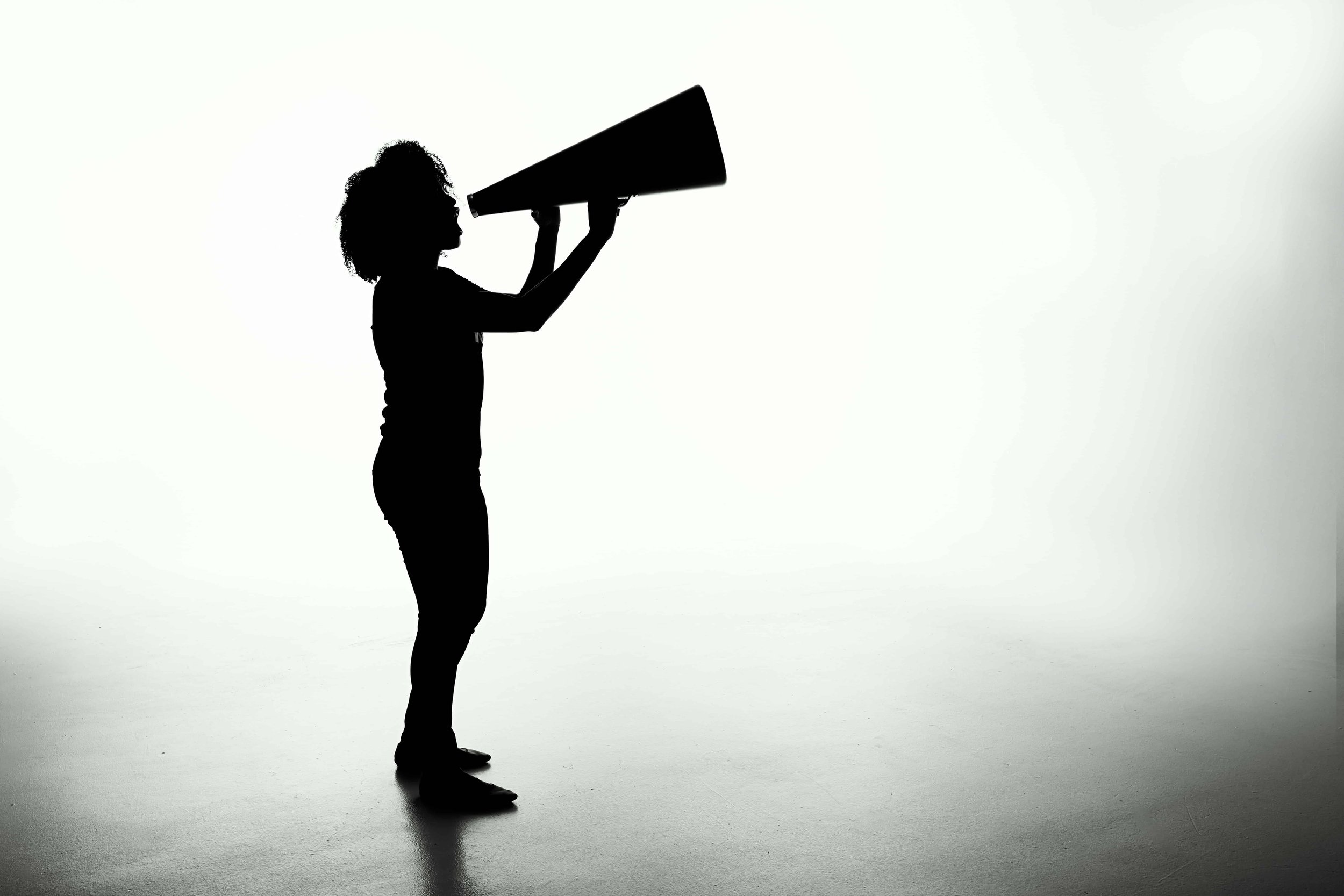 A black and white image of a woman shouting
