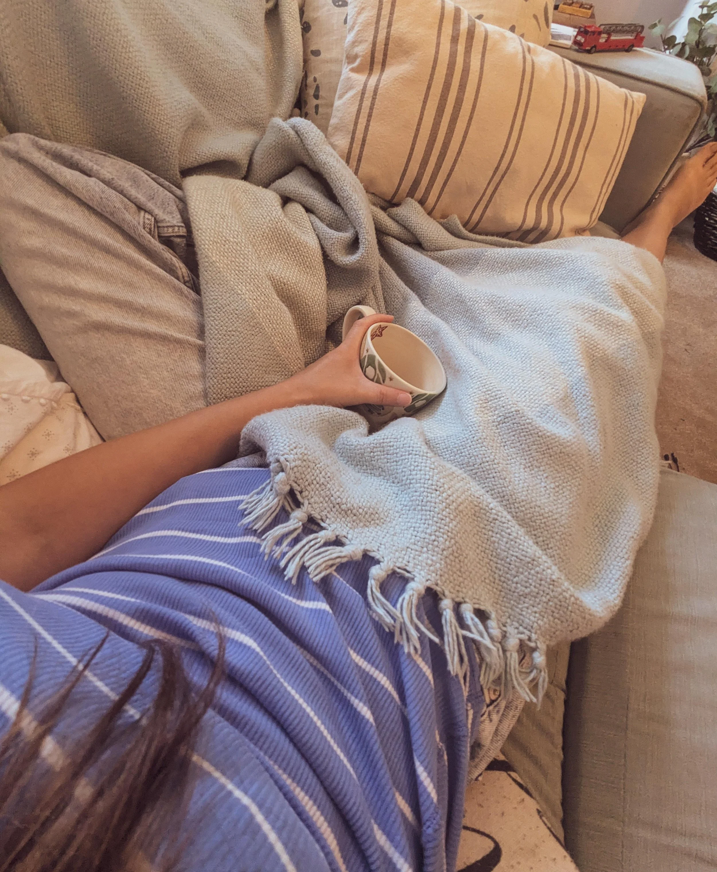 Feet up, blankets and a bed of cushions