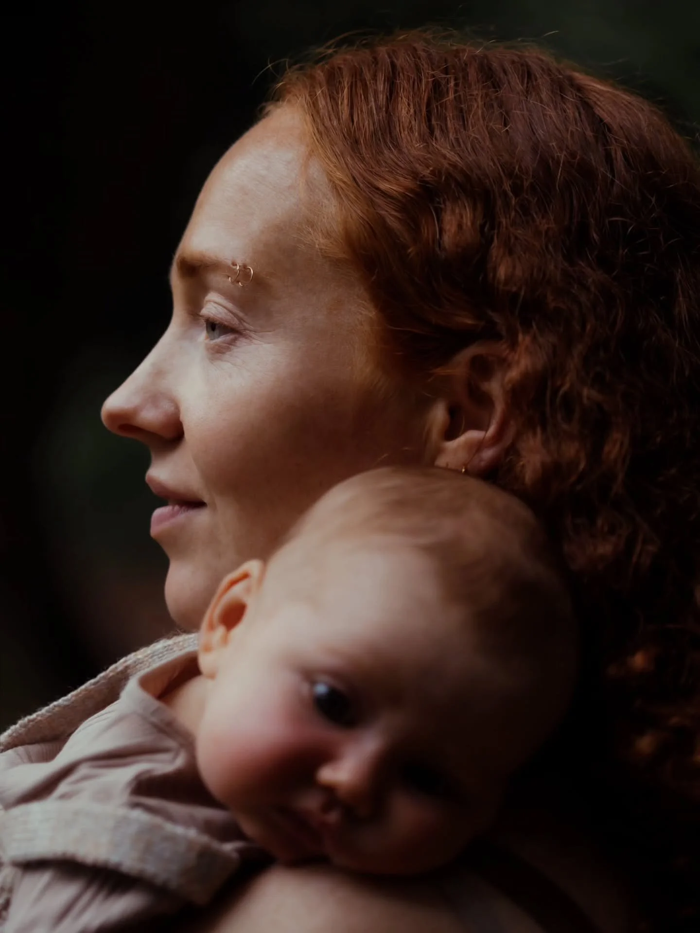 She's the one with little arms wrapped around her neck, tiny hands tangled in her hair.

The one who lifts them higher when they want to see the world, even when her shoulders are already tired.

Carrying them close, so they always know exactly where