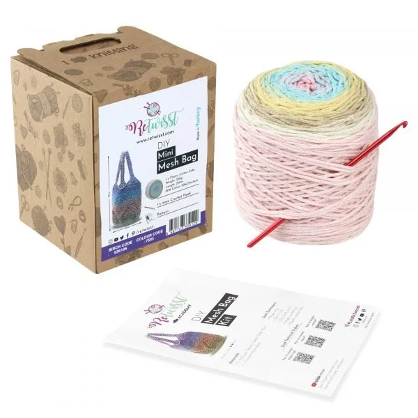 Retwisst Mini Mesh Bag Kit in candy showing box, yarn cake, crochet hook and instructions