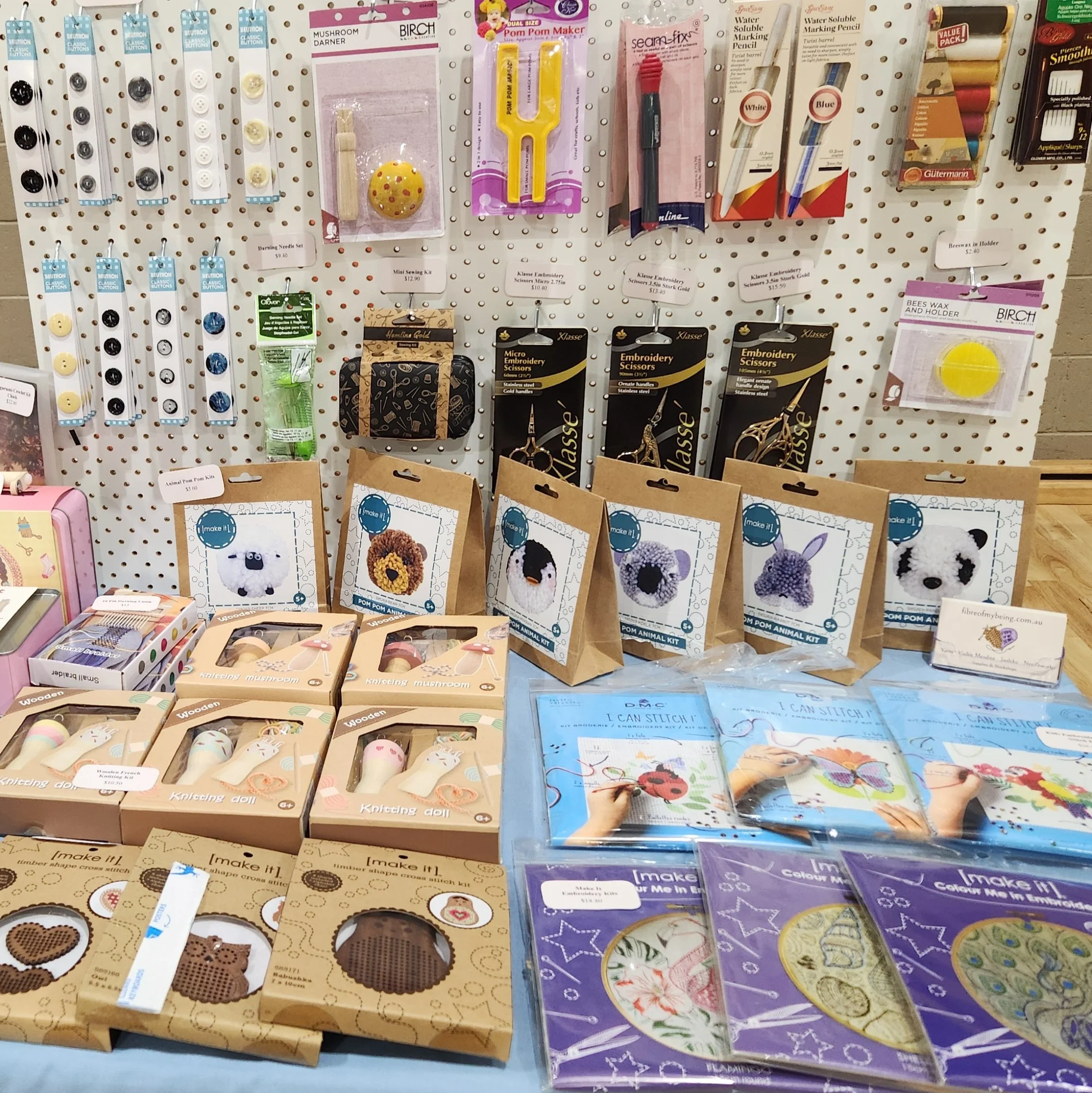 Market stall showing sewing, fibre craft, embroidery and fun kits for kids