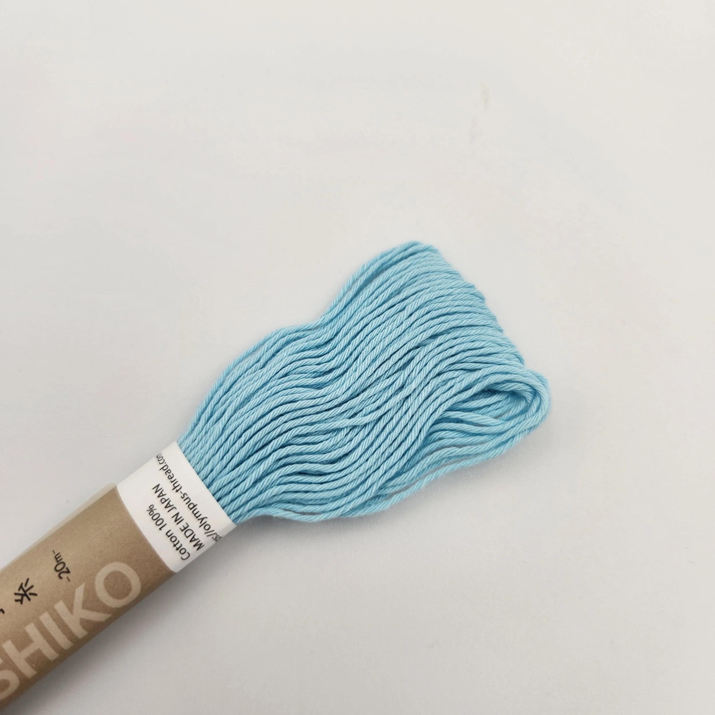Olympus sashiko thread 20m skein, light blue.