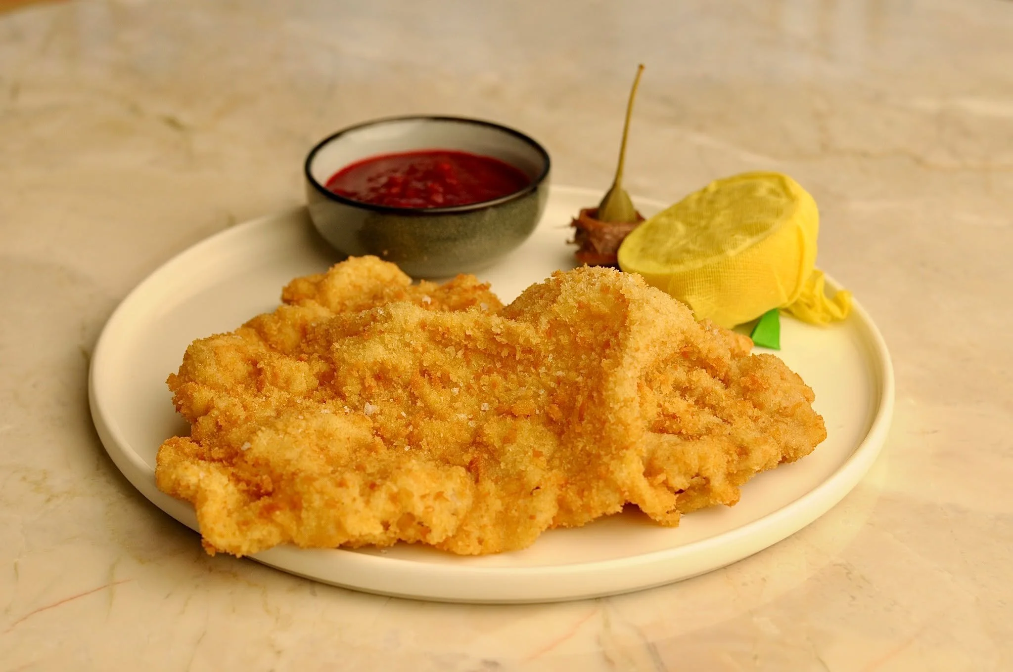 The simple classics, done to perfection &ndash; our all-time favourite: the Wiener Schnitzel. 🍋🌟

#Wienerschnitzel #ClassicCuisine #GourmetDining #TraditionalFlavours #AustrianCuisine #FoodieHeaven #ComfortFood #SILKRestaurant #FineDining #Foodstag