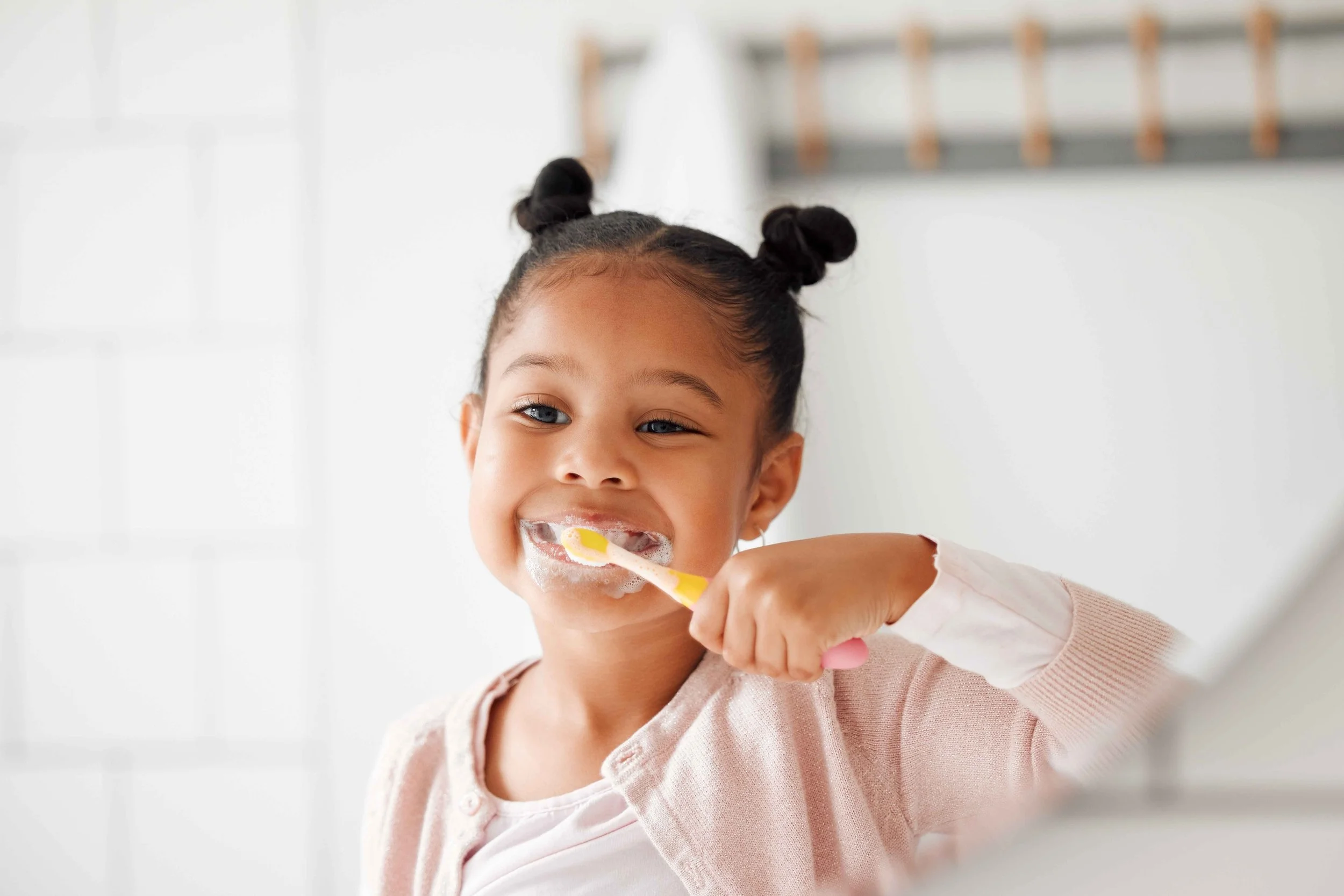 Little girl brushing teeth