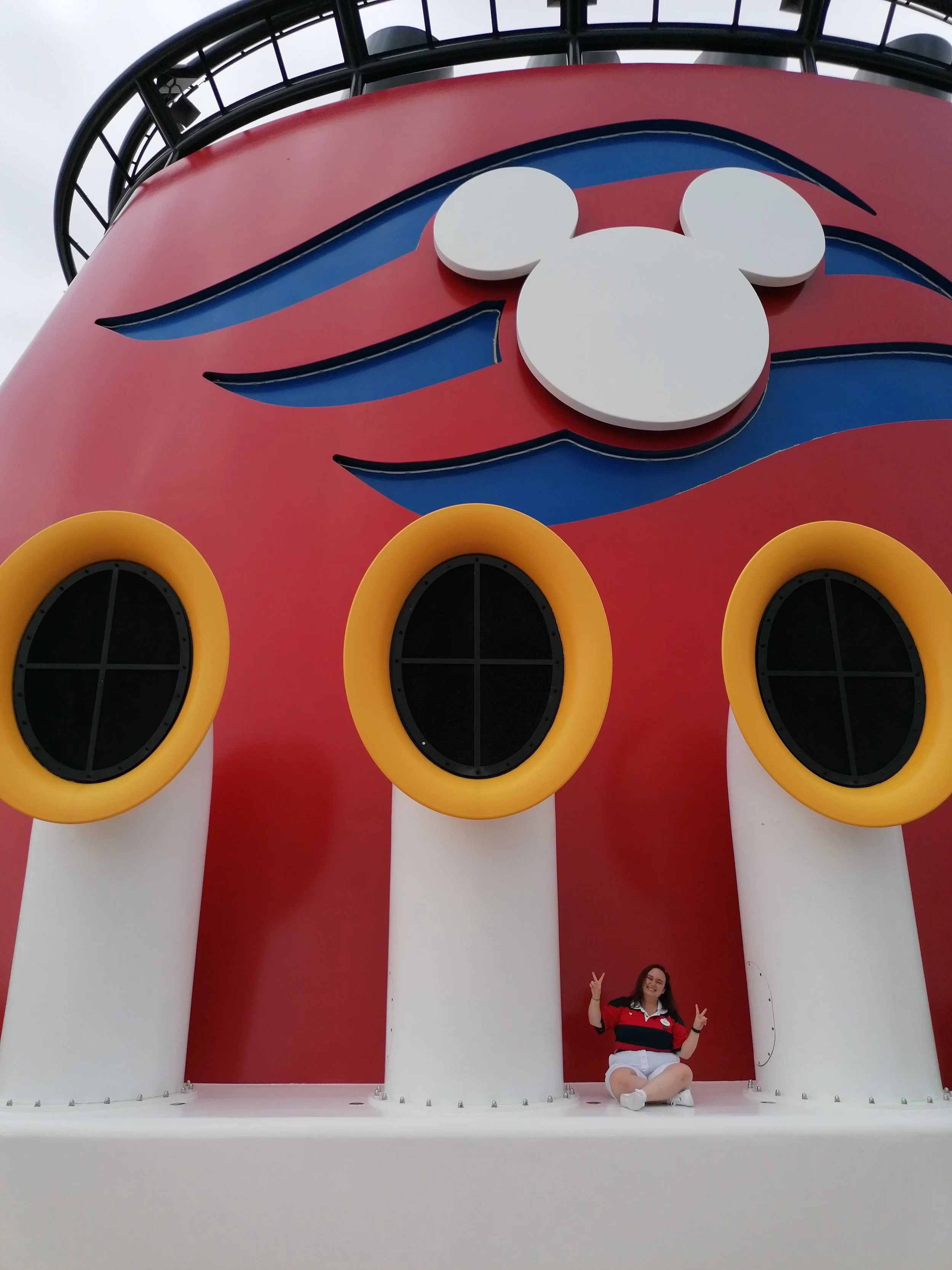 Emily Stangroom sitting next to the Disney Fantasy funnel