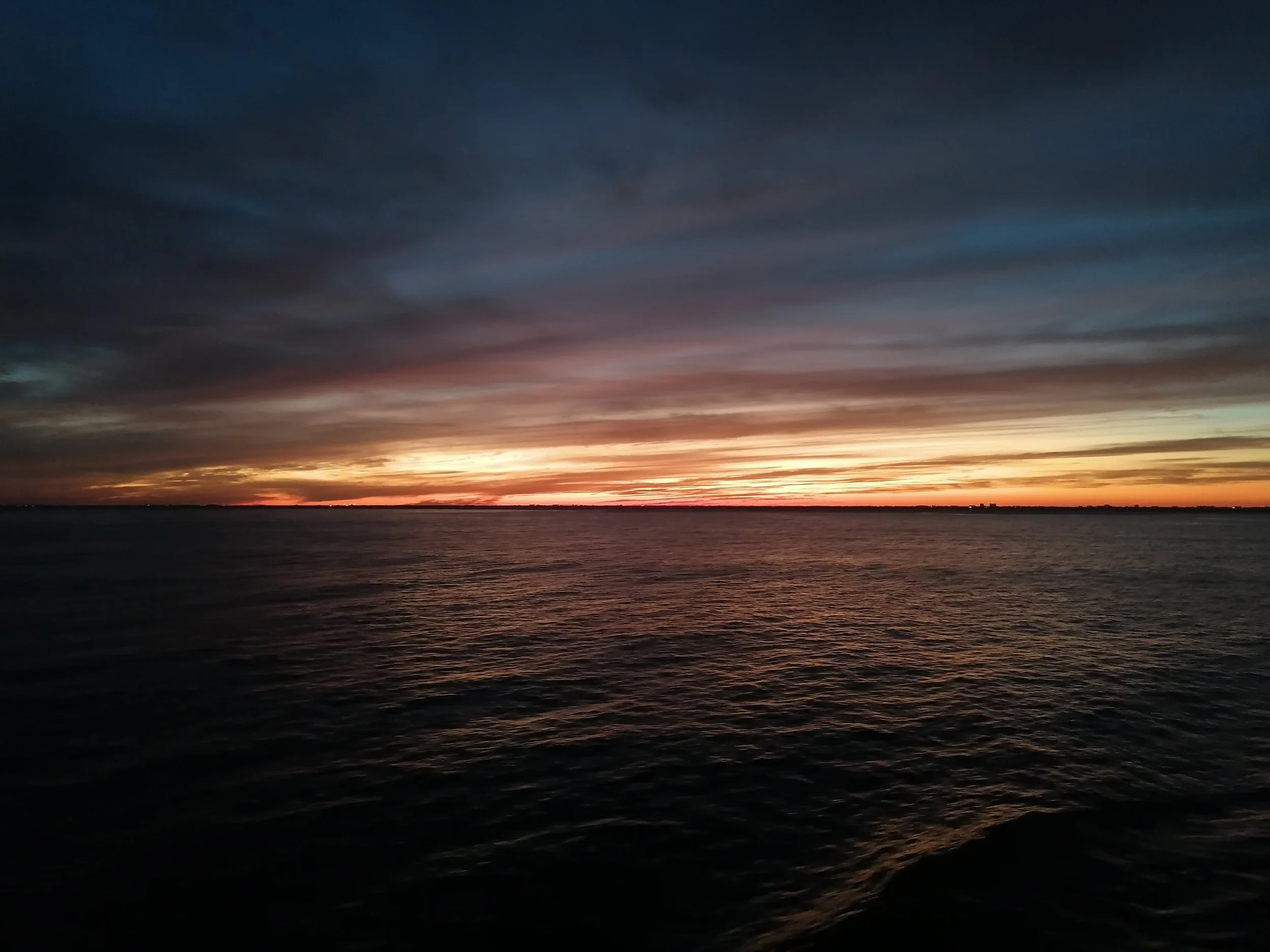 A beautiful sunset over the ocean seen from the Disney Fantasy