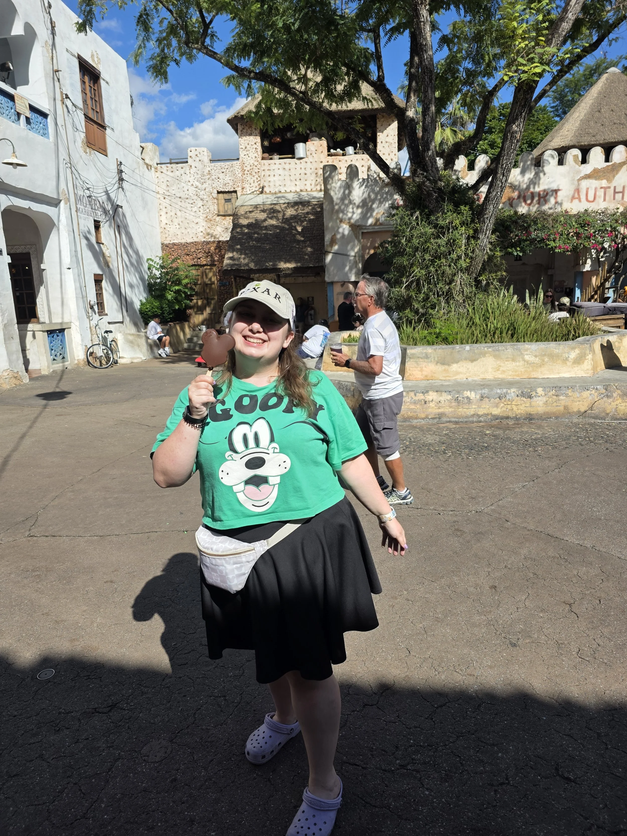 Emily eating a Mickey premium bar in Animal Kingdom
