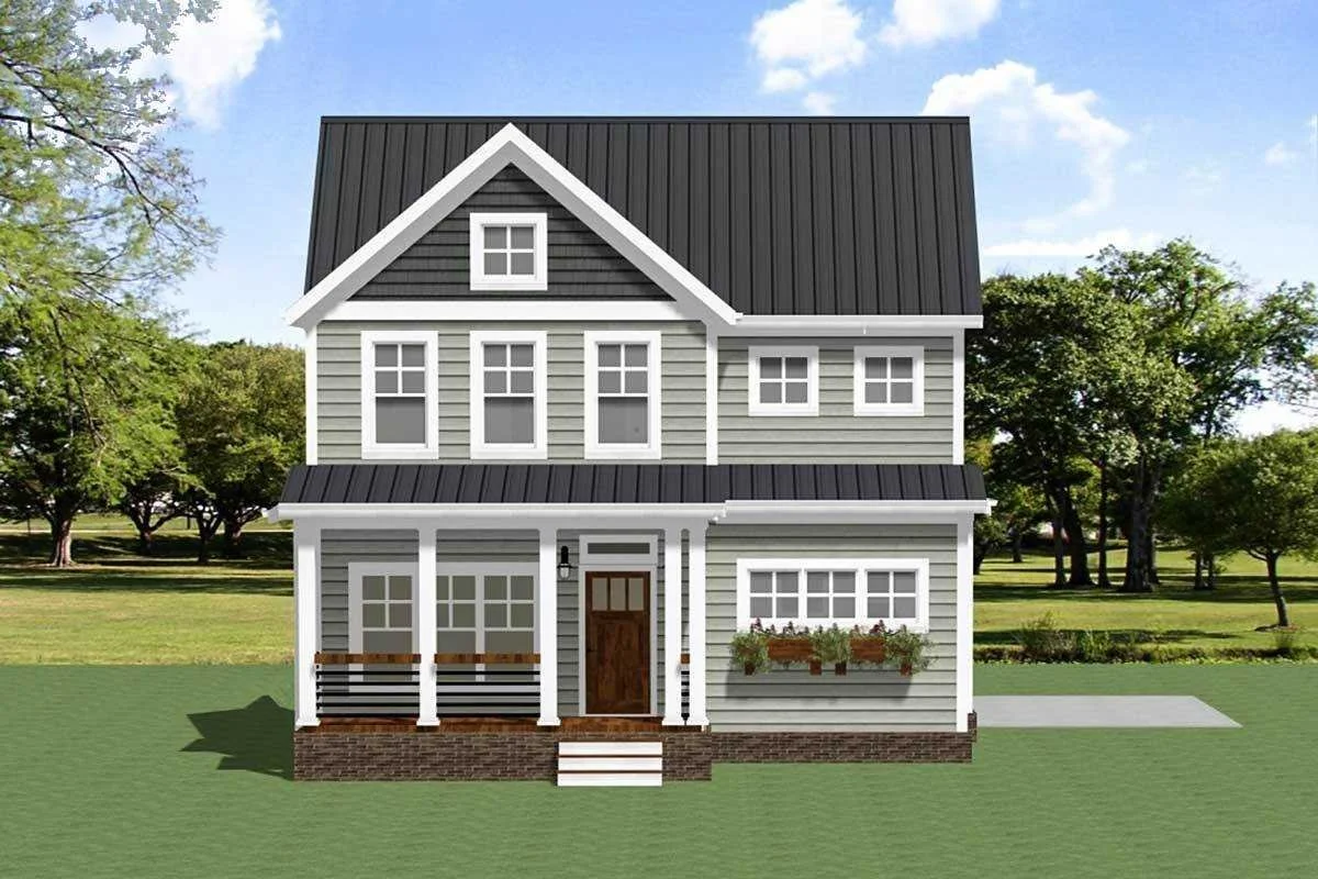 Front view of a modern two-story house with gray siding, white trim, a dark metal roof, a front porch with white pillars, a small staircase, and a lawn with trees in the background.
