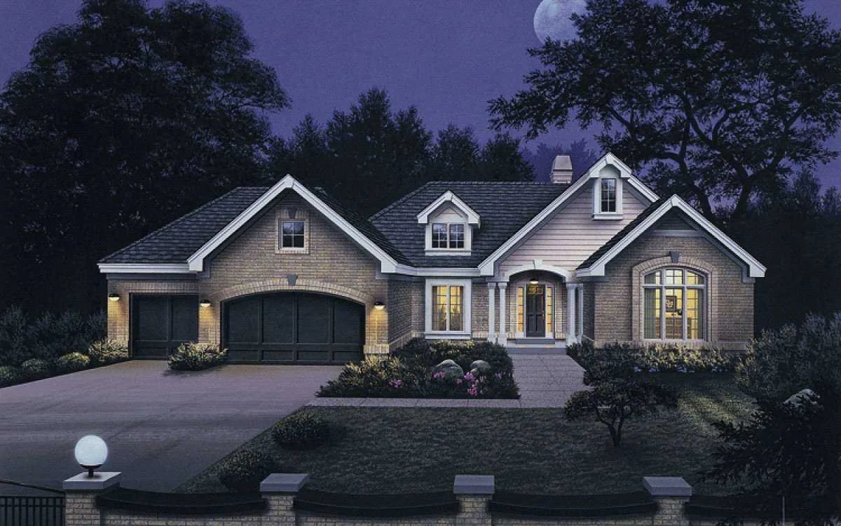 A large, illuminated house at night with a full moon in the sky, surrounded by trees and a landscaped yard.