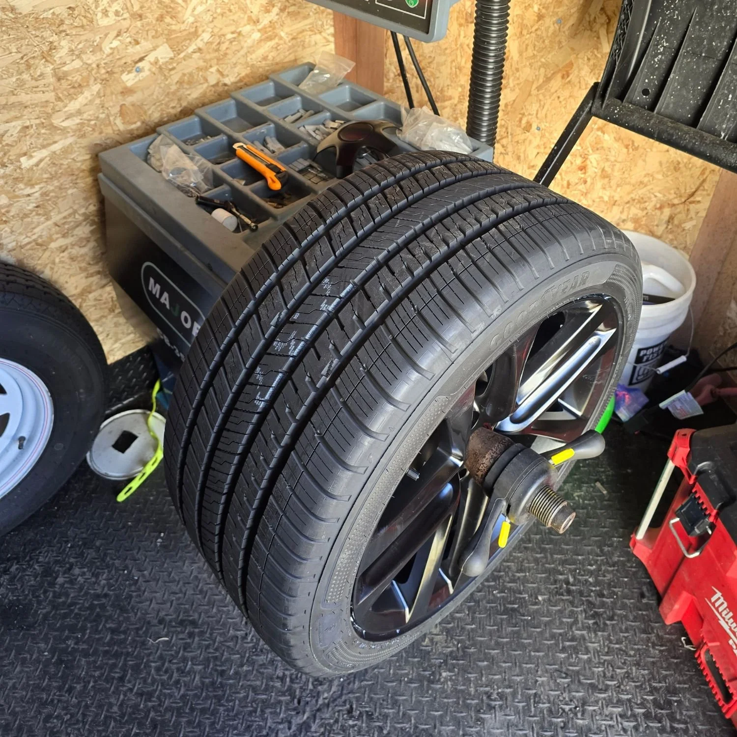 Re-balancing a wheel during a seasonal tire changeover in Ajax, Ontario.