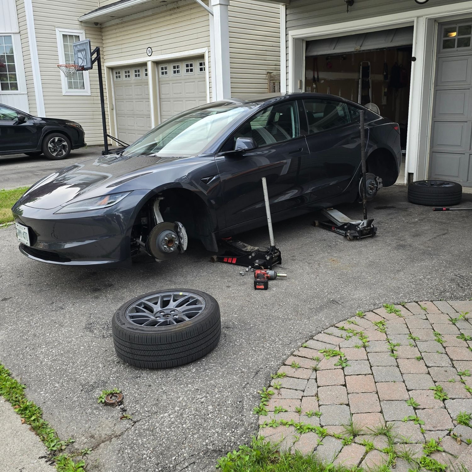 Tesla Model 3 tire rotation at home, for a customer in Durham Region, Ontario, Canada.