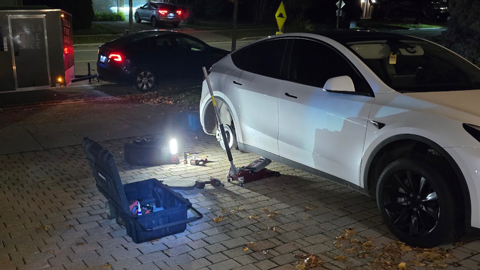 Repairing a Tesla flat tire at home, in customer's driveway in the Greater Toronto Area