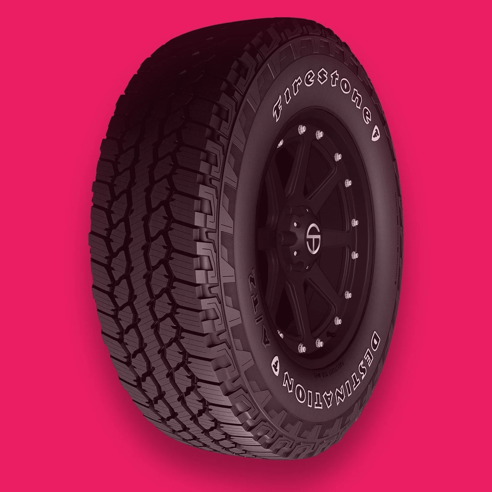 Firestone Destination A/T2 all-terrain tire on a hot pink background