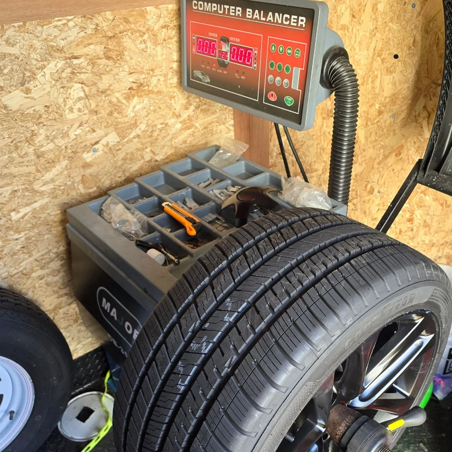 Balancing a wheel for a customer in Durham Region, Ontario - at home, in their driveway.