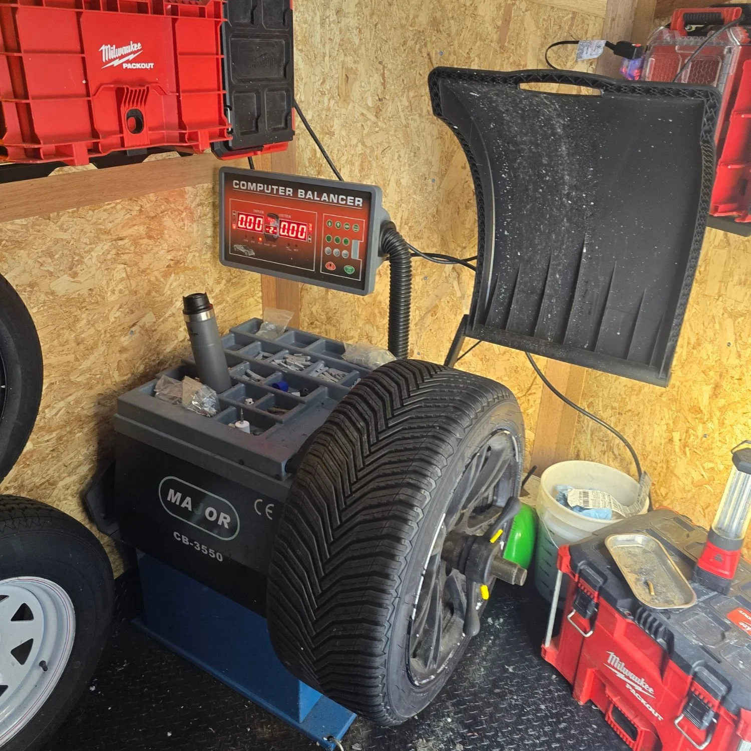 Re-balancing a wheel with a freshly repaired tire.