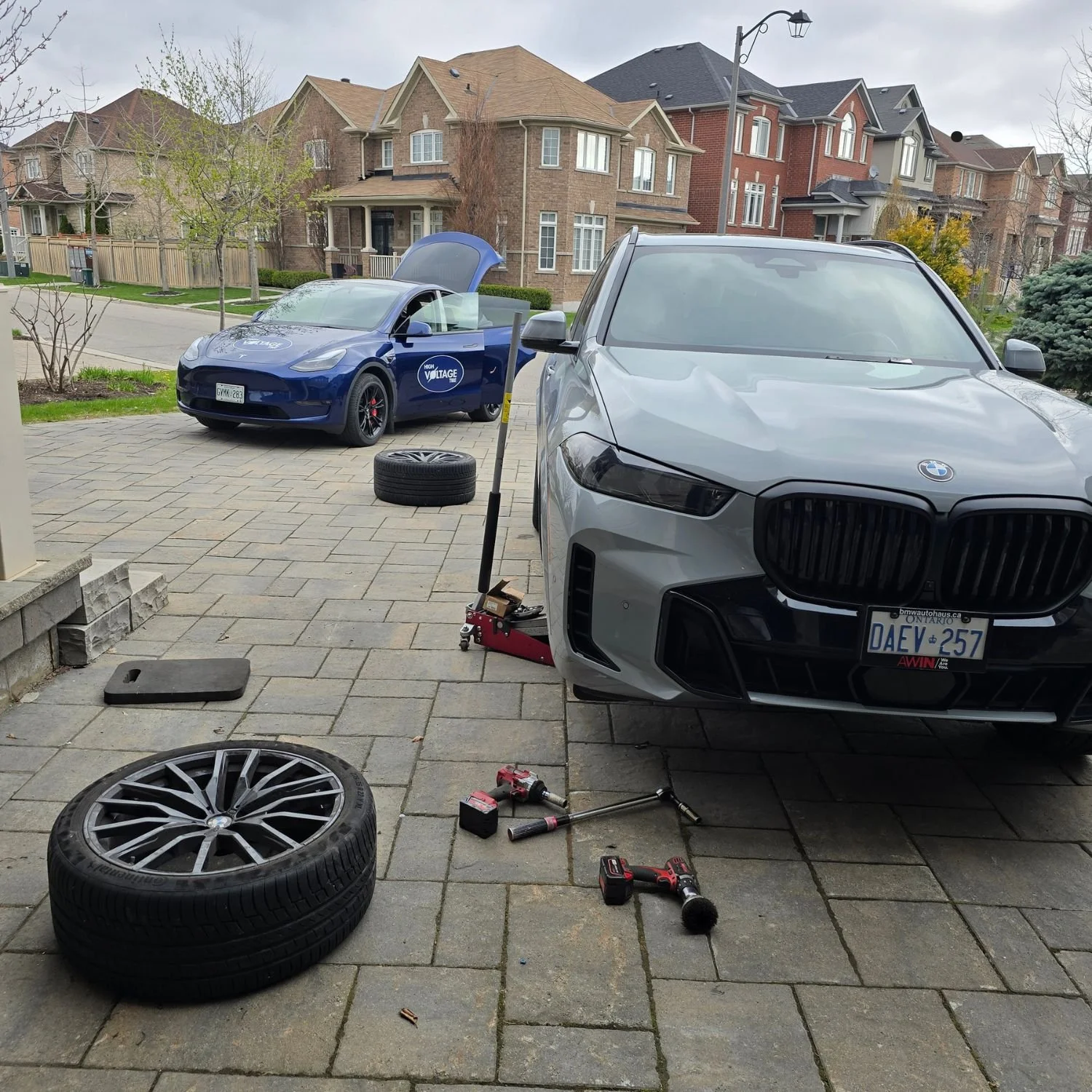Mobile seasonal tire change in Richmond Hill, Ontario, performed in customer's driveway, for a luxury vehicle.