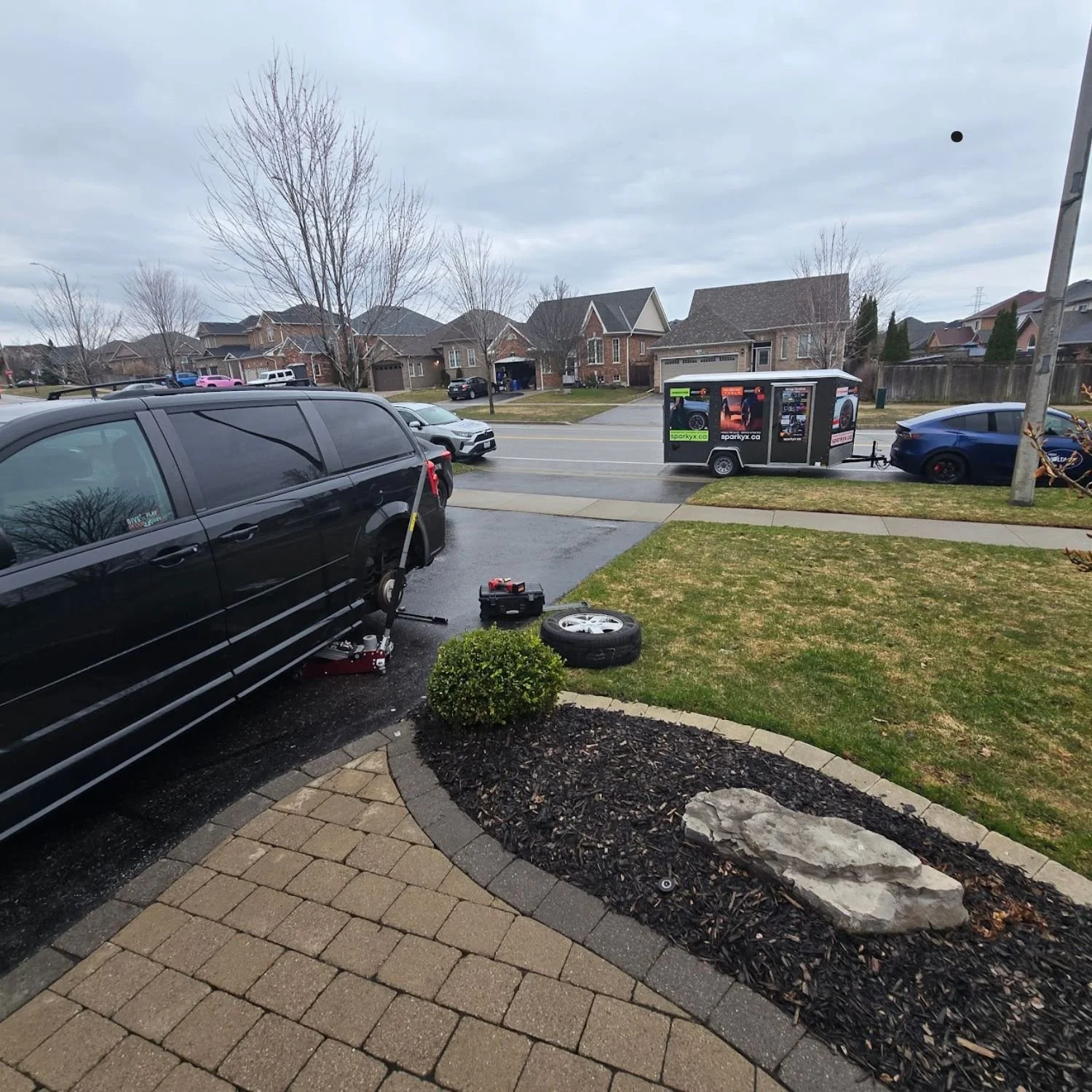 Seasonal tire change in Oshawa, Ontario, Dodge Caravan - at home, in customer's driveway.