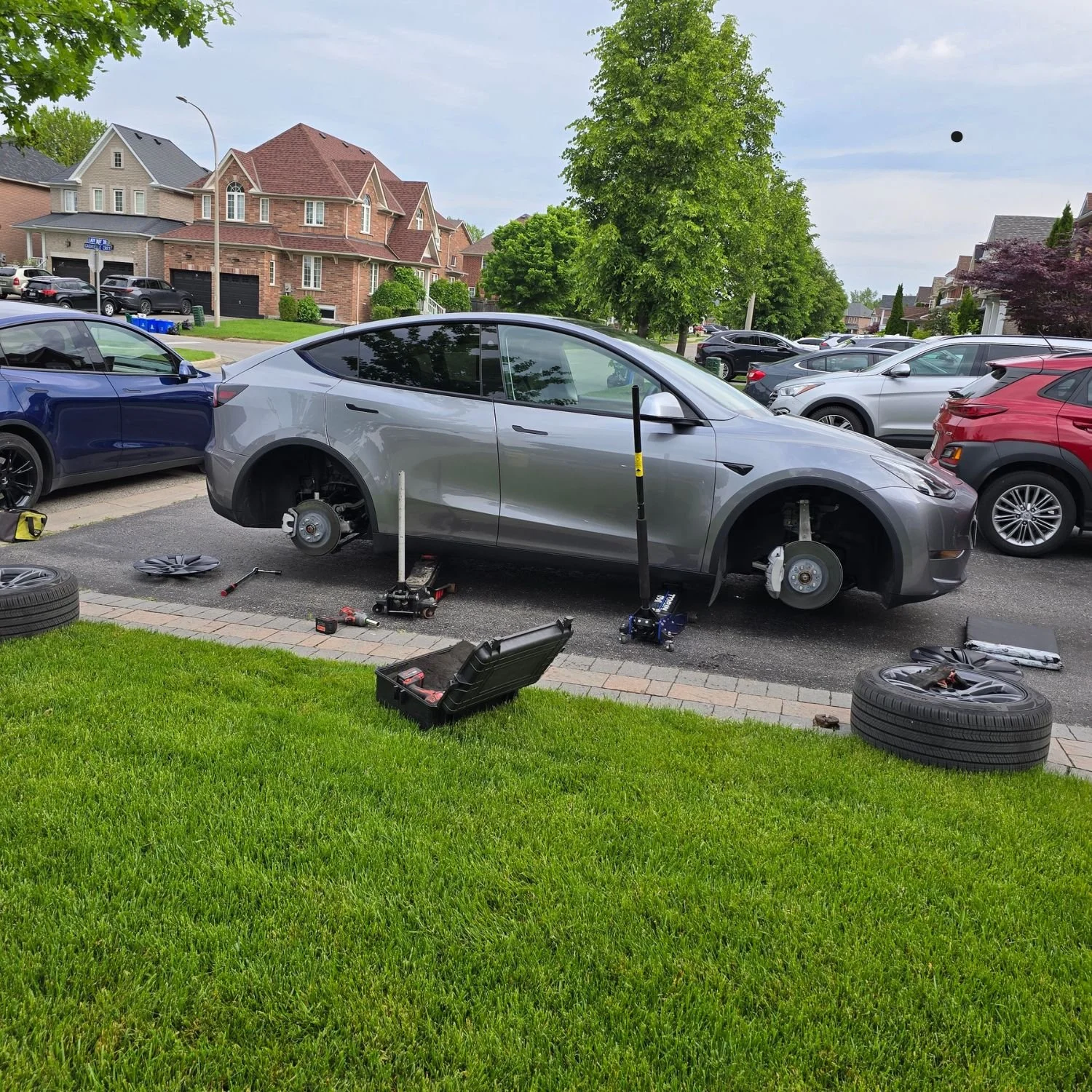 10,000 km mobile tire rotation service provided for a customer with a Tesla Model Y in Whitby, Ontario.