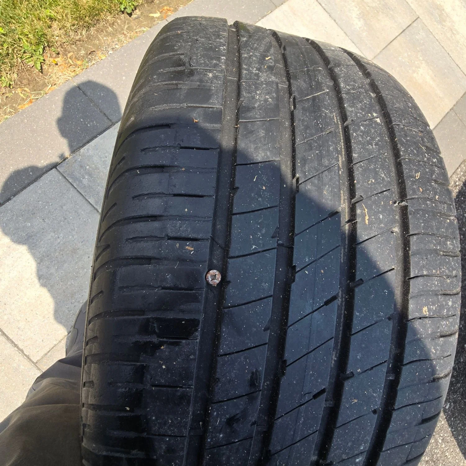 A punctured tire injured by a screw with the punctured size lest than 0.25 inch.