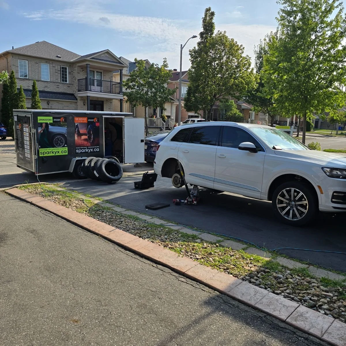 Changing tires in the driveway before the cold comes, for a customer in the Greater Toronto Area, in his driveway, at home.