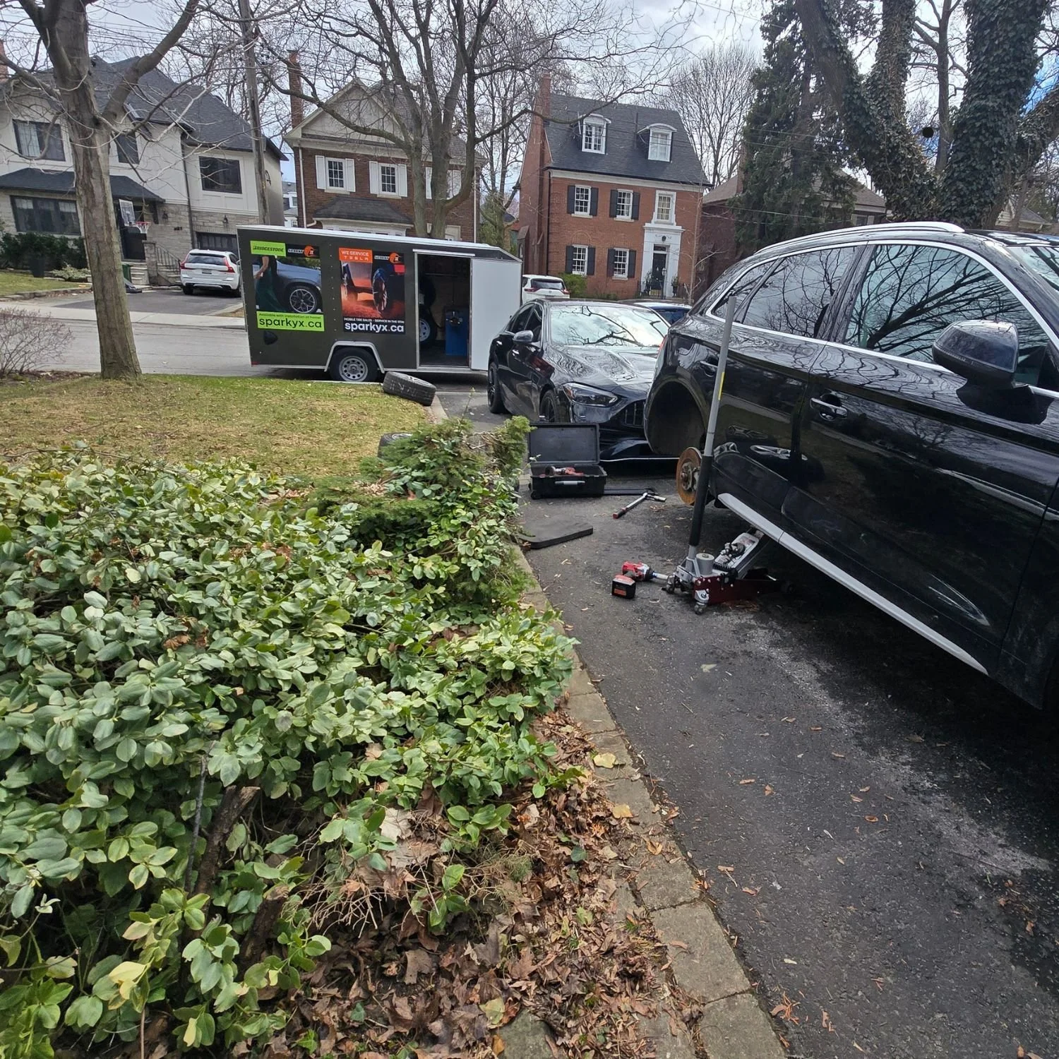 Rotating tires for an Audi Q5 on customer's driveway in Toronto, Avenue Road & Lawrence area.