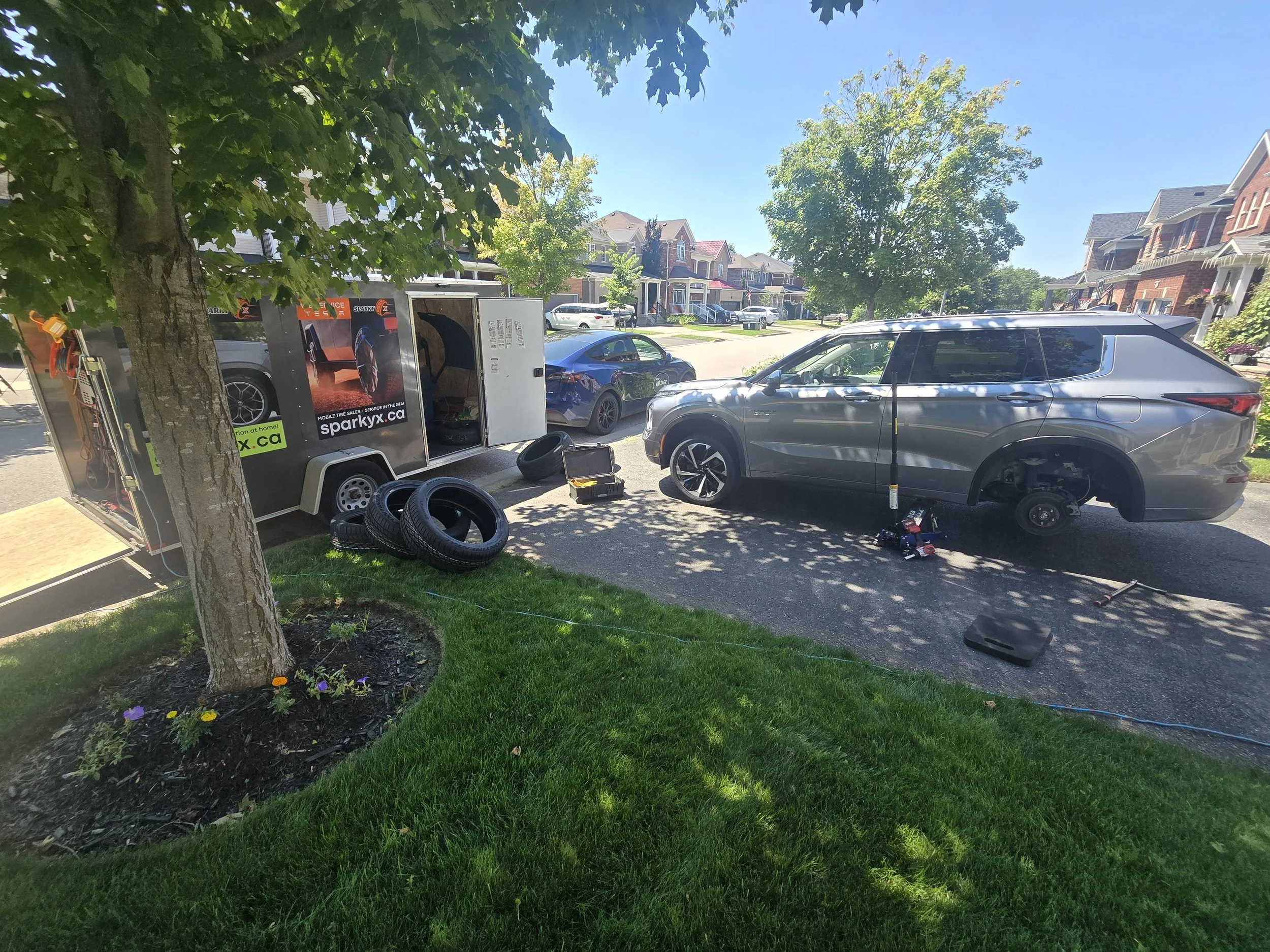 Mobile tire service in a Whitby driveway.