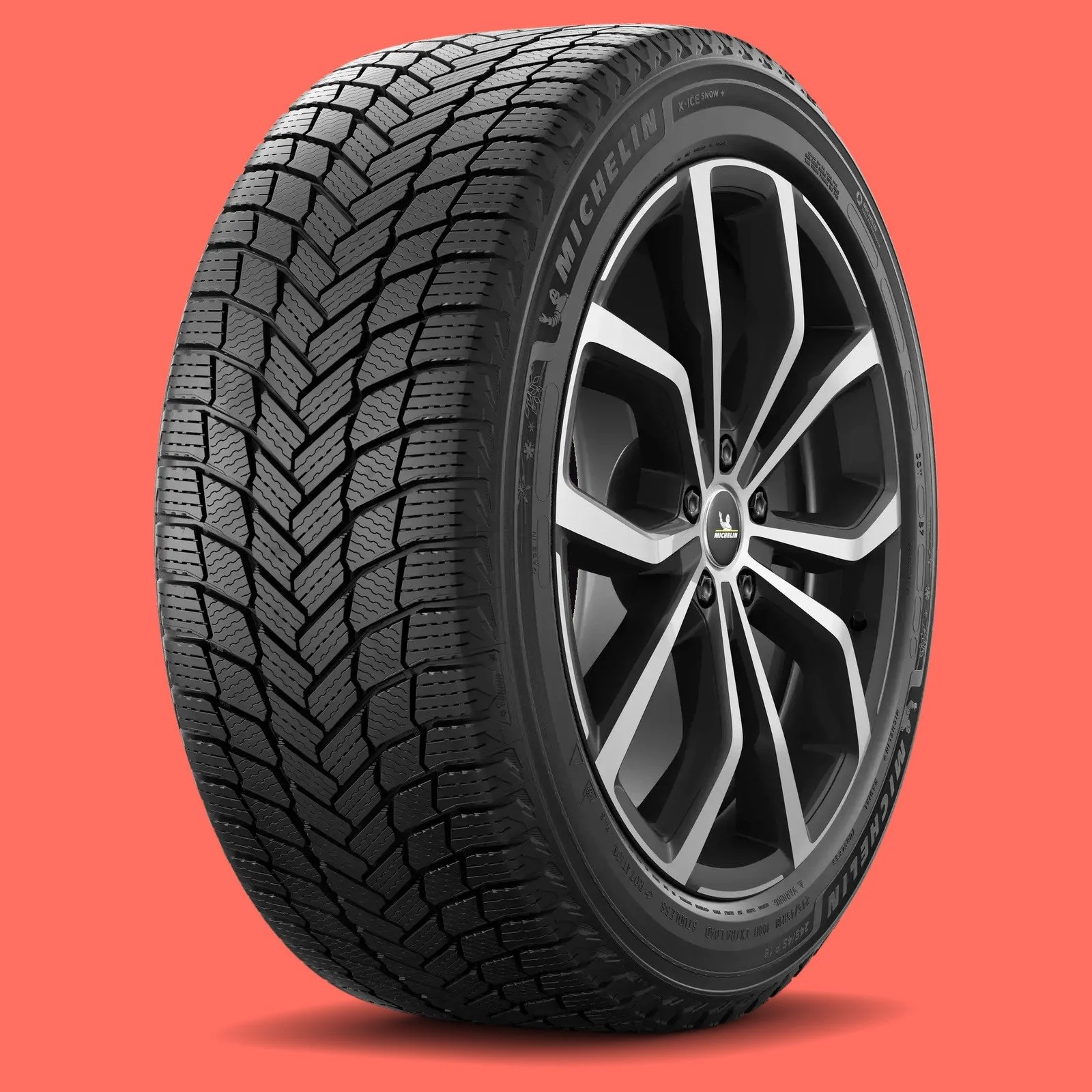 Michelin X-Ice Snow+ winter tire on a living coral background