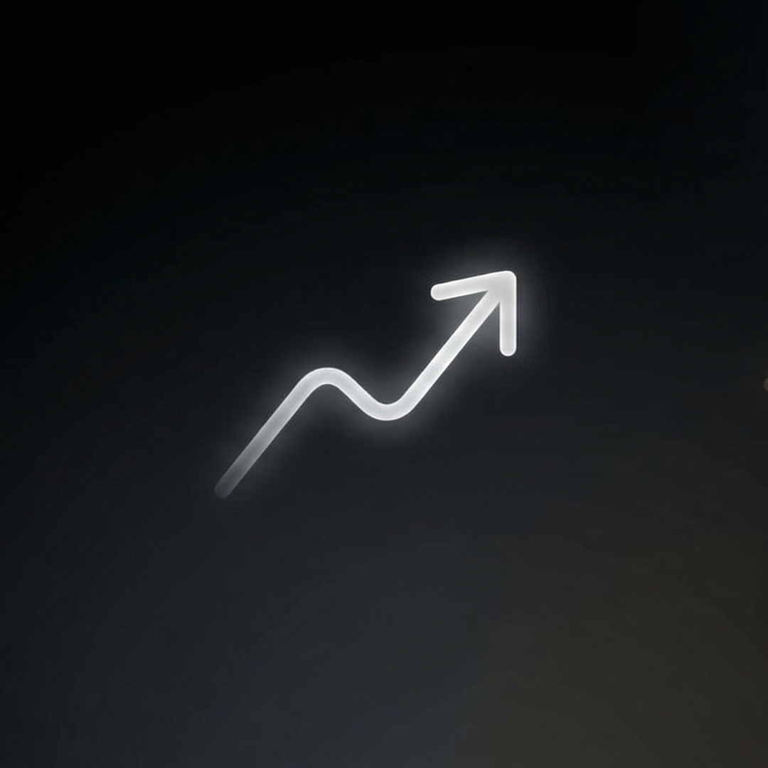 White illuminated upward trending arrow on a black background.