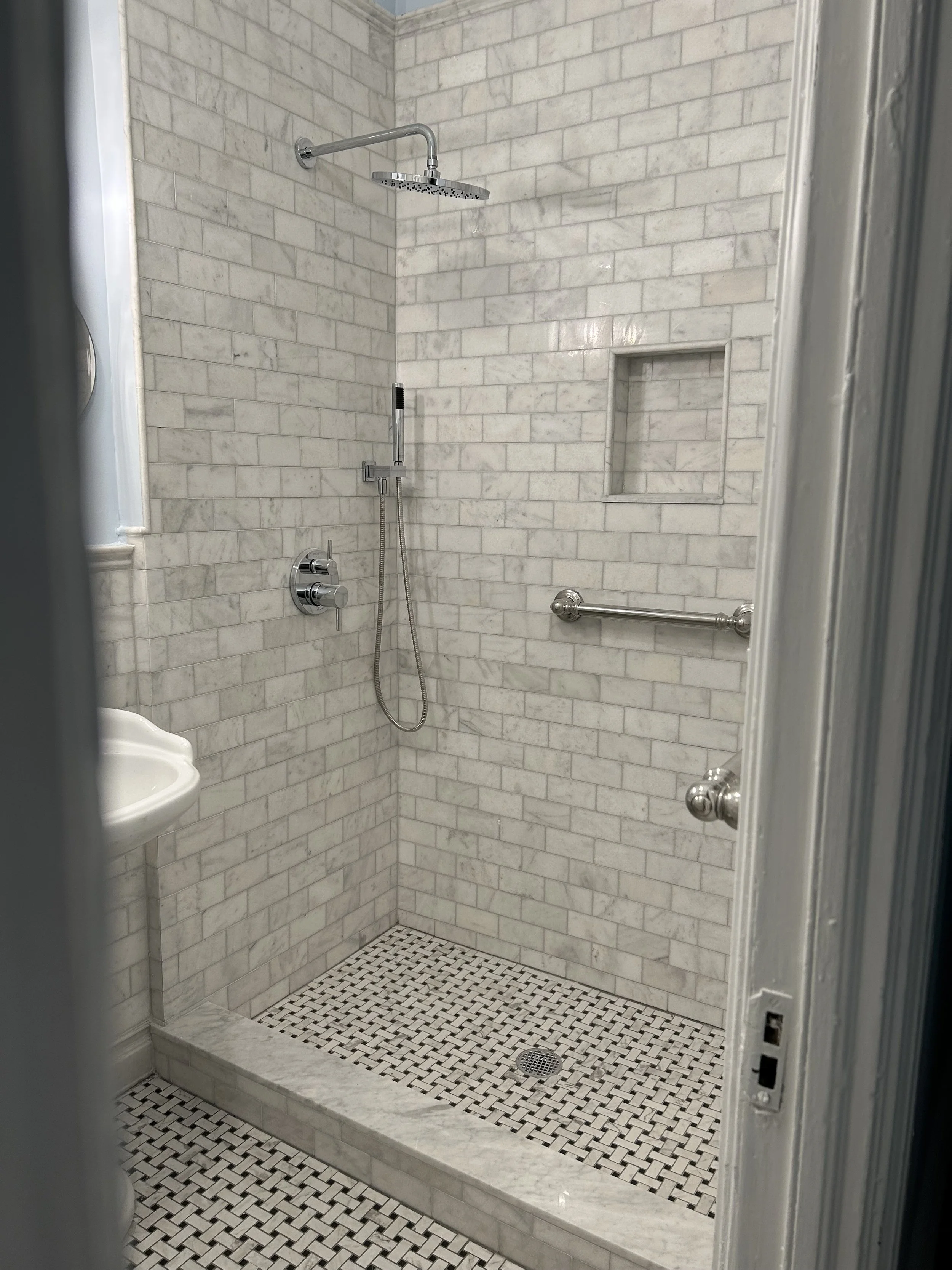 Grab-bars, handheld shower wand with bar, custom shower door, low curb, premium tile