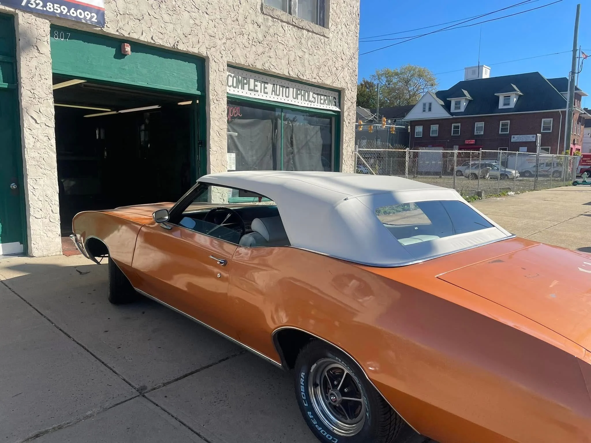 orange Corvette with cream convertible top