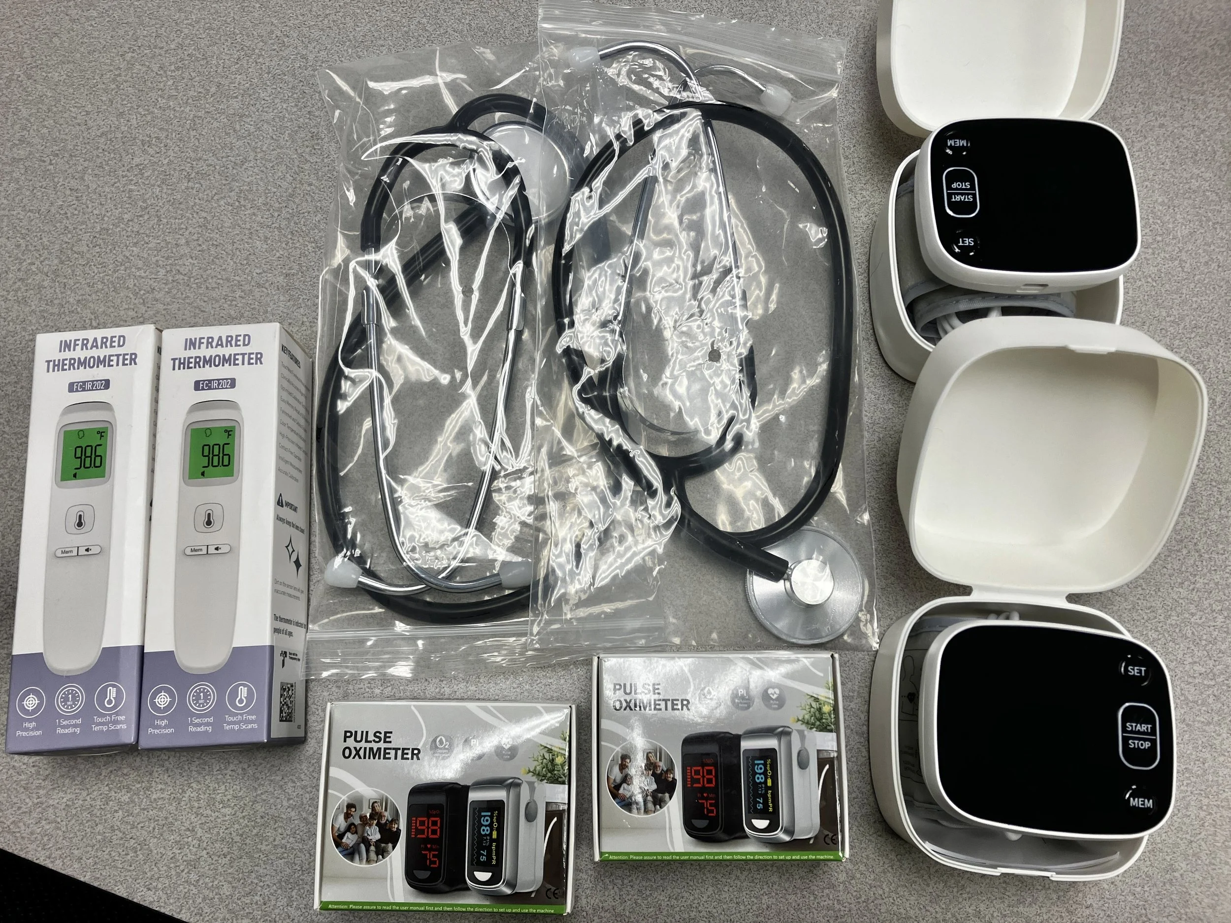 Image of digital thermometers, pulse oximeters, stethoscopes, and blood pressure monitors