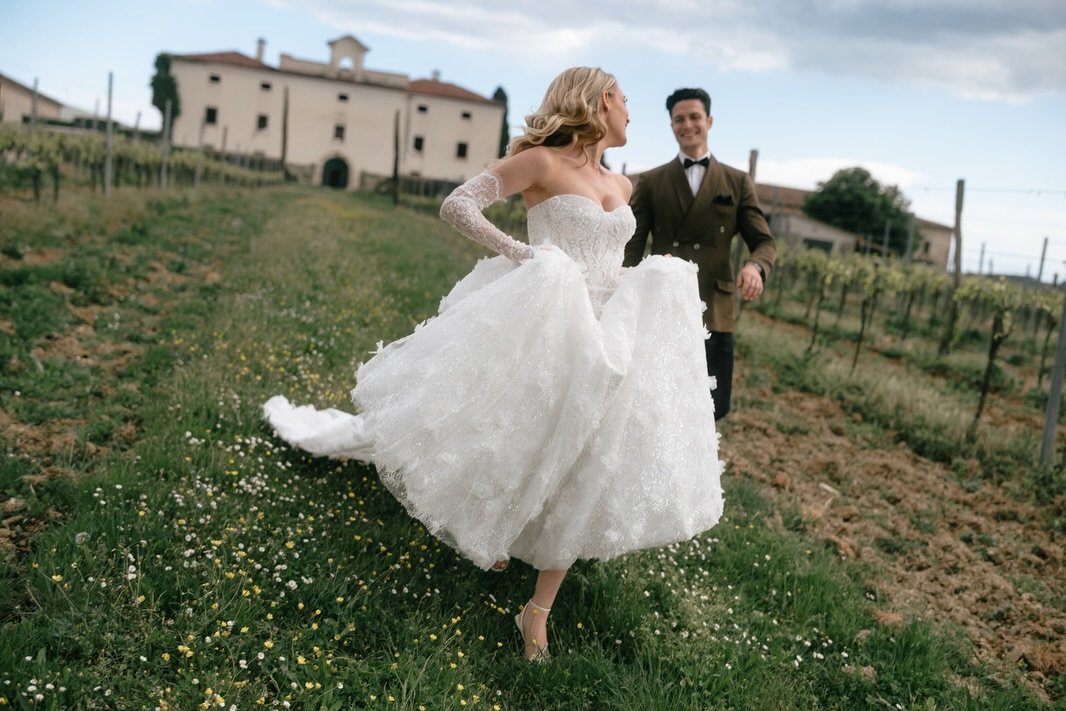 Moving from the quiet bridal moments into the heart of the castle grounds. There is something
so striking about the soft lines of @wona_concept lace and the rugged, historical textures of @castlebelaj 

Beyond these ancient walls, the lush Istrian vi