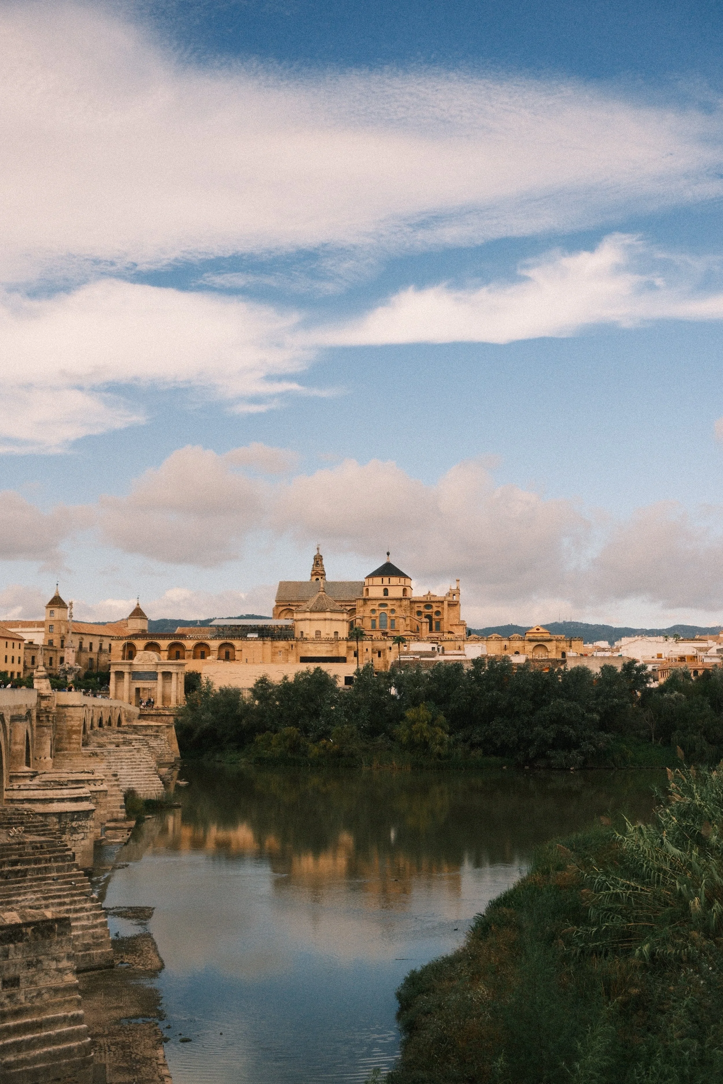 Mezquita-Catedral and the Roman bridge reflected in the Guadalquivir river, Córdoba, Andalucía, Spain - fine art print by Zyan Sachs