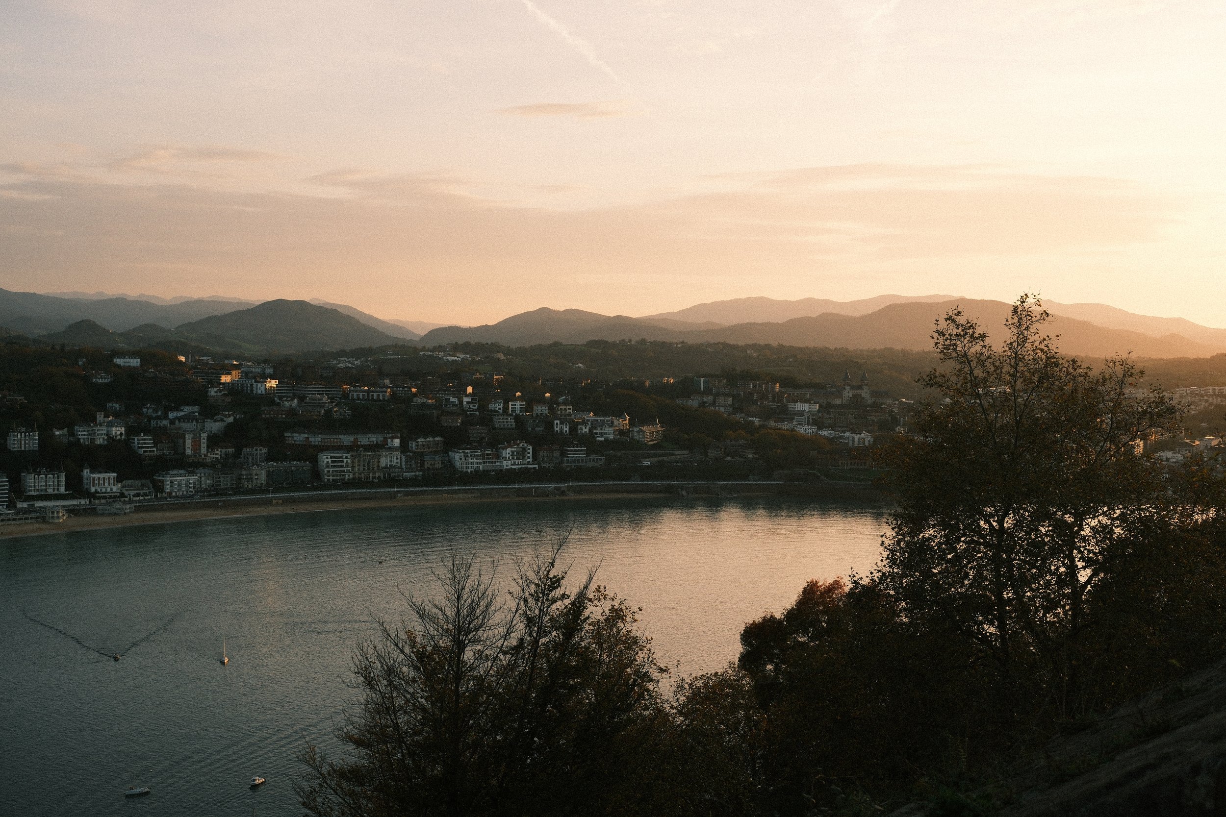 La Concha bay and the city at sunset from Monte Igueldo, San Sebastián, Basque Country, Spain, by Zyan Sachs