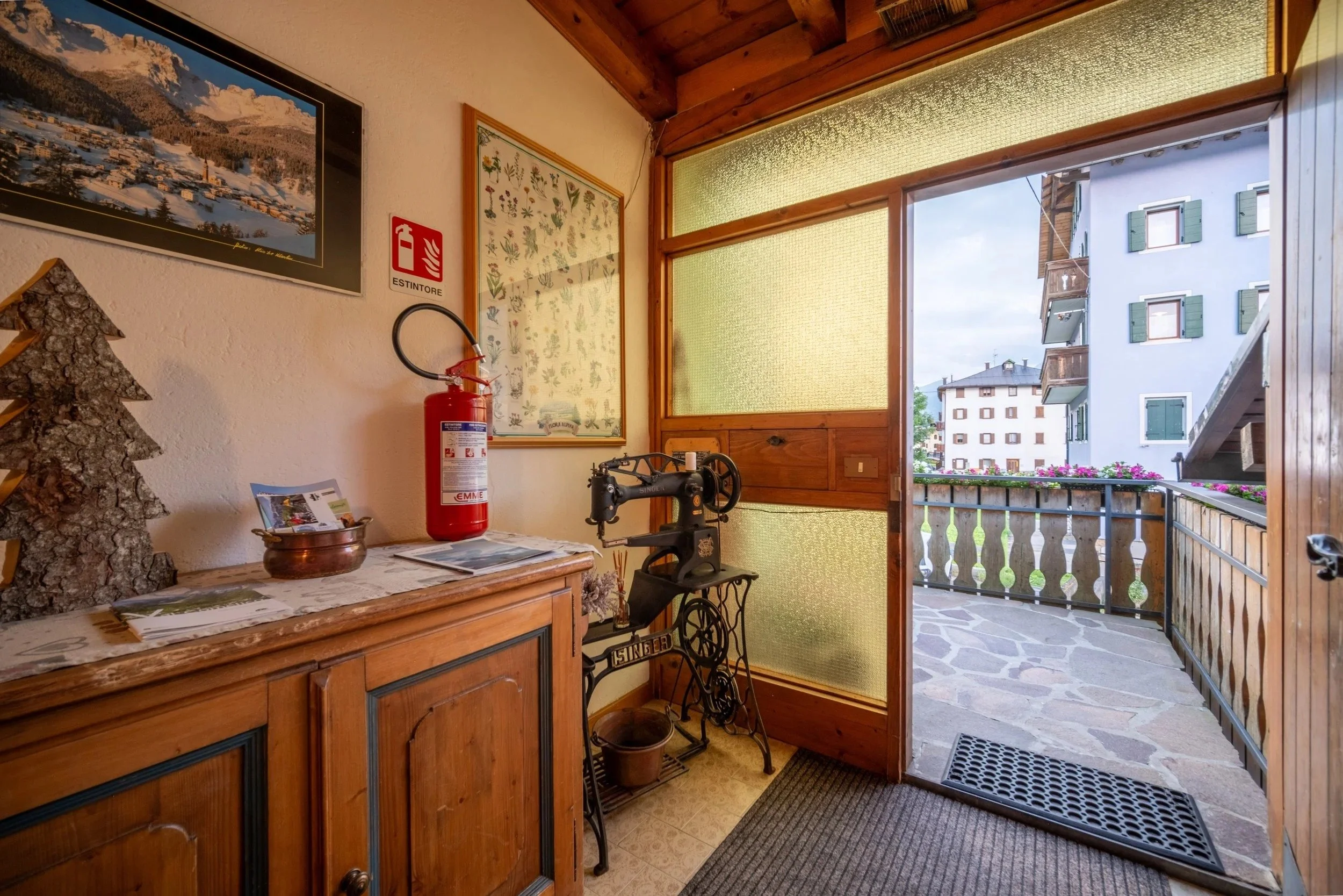 Kitchen opening onto a sunny balcony at Al Borgo da Agata, Dolomites - hospitality photography by Zyan Sachs