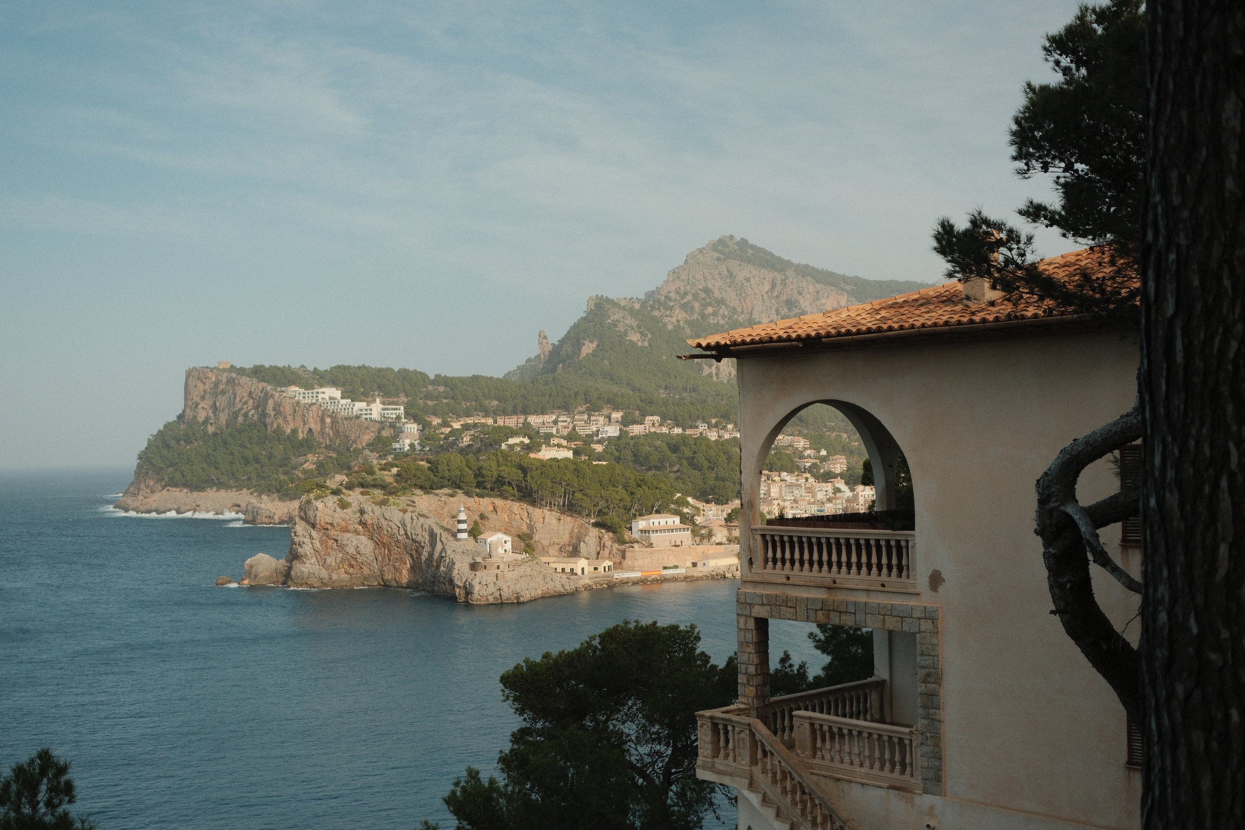 Coastal cliffs seen past a stone watchtower window, Serra de Tramuntana, Mallorca, Spain, by Zyan Sachs